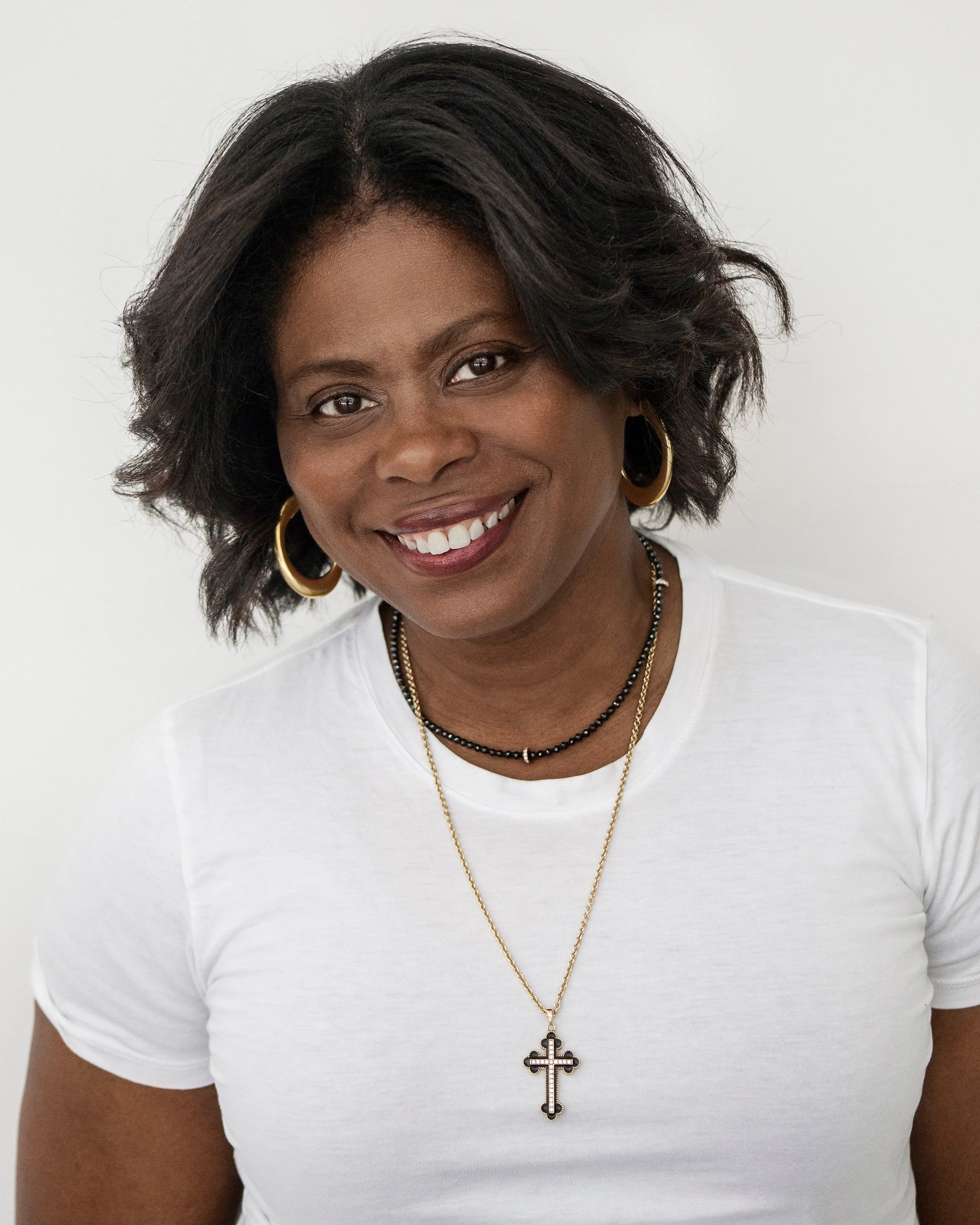 Meg Charles working and writing representing creation of the Personal Equity Framework