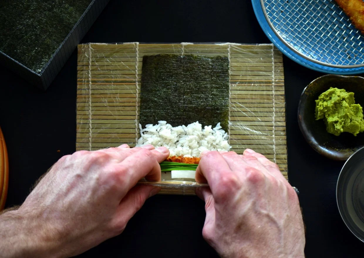 Lift up the mat and bring it over the filling