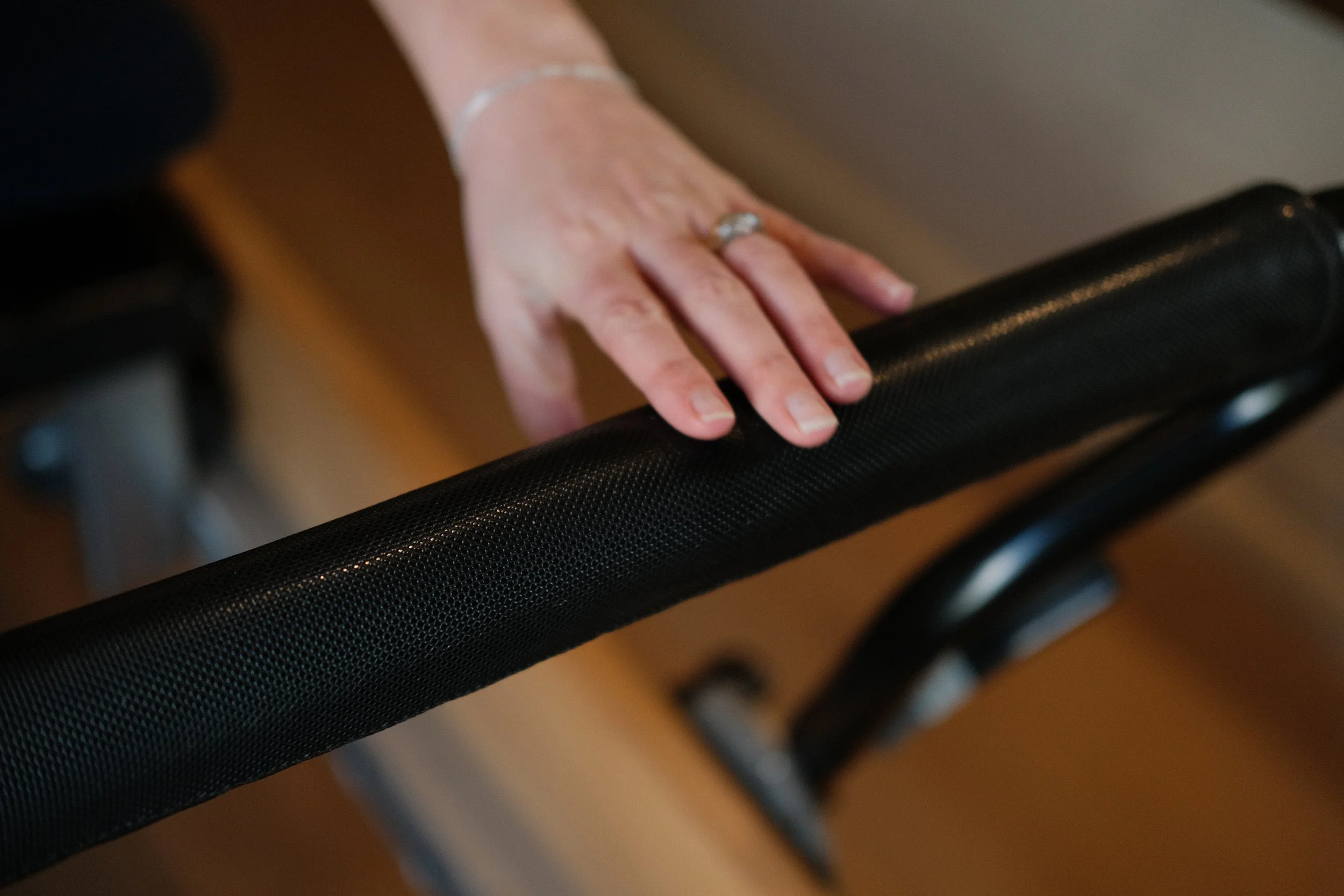 Rasheeda holds the footbar on the Clinical Reformer in her private studio in South West London.
