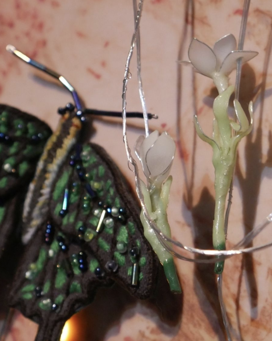 "Ang Kwento Ng Dalawang Indayog" (Aliptaptap At Alibangbang) Gerecho Iniel Cruz, Katherine Nuñez 15" x 10" inches Thread, naturally dyed fabric, copper, resin, circuits 2026 Exhibited at TLYR Collective's 'Habilin' at Art Fair Philippines 2026