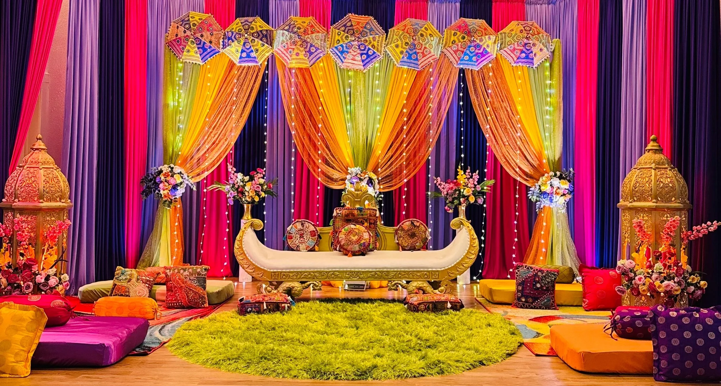 Laurie’s customers, Mariana and Carmen holding hands on a green lawn on their wedding day.