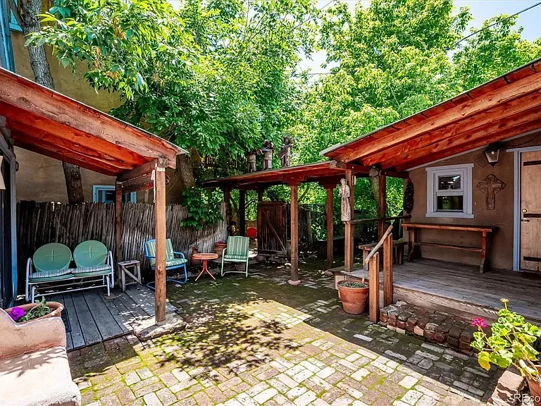 View of the courtyard between two Santa Fe style cabins.