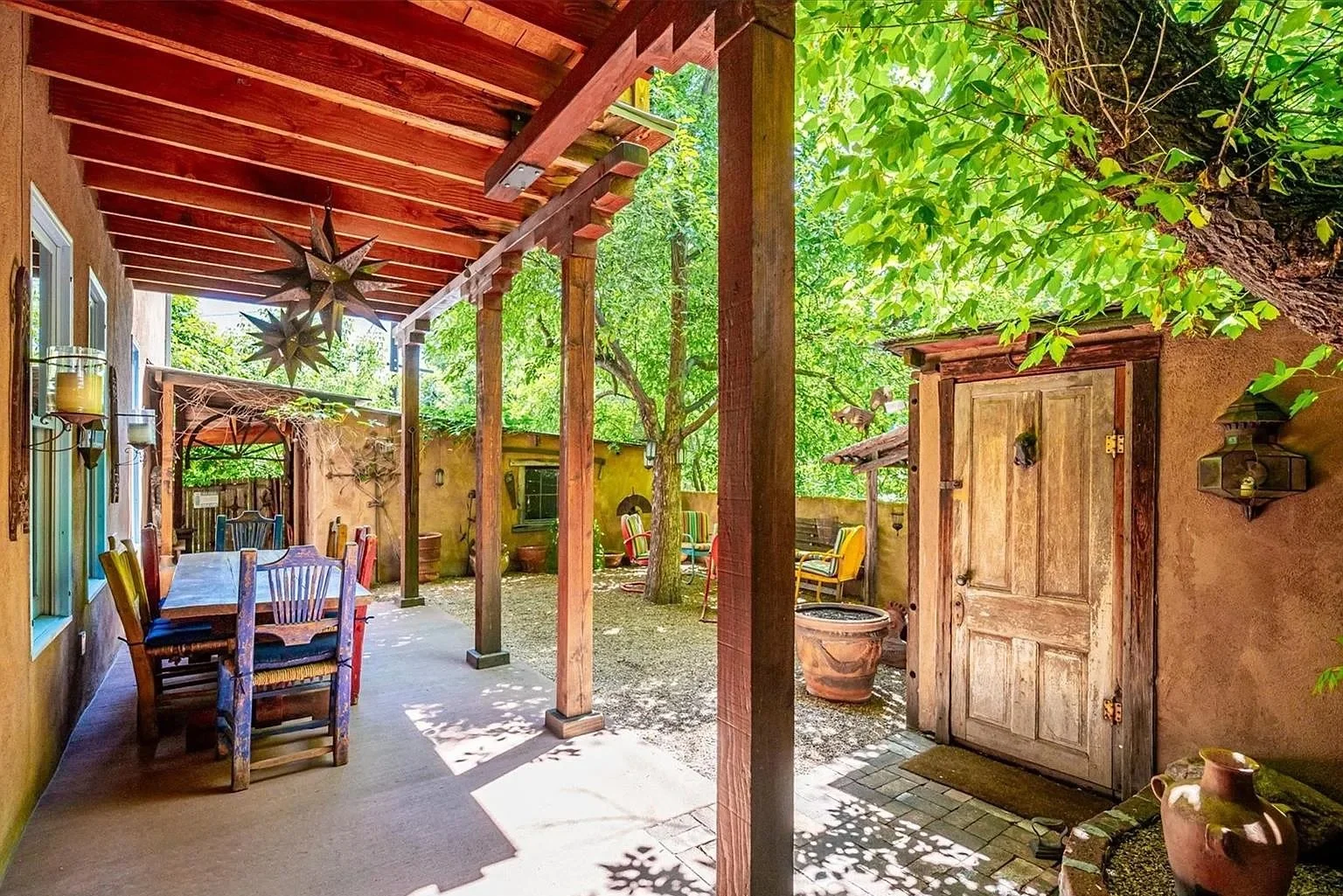 Southwest tyle courtyard between a house and a shed.