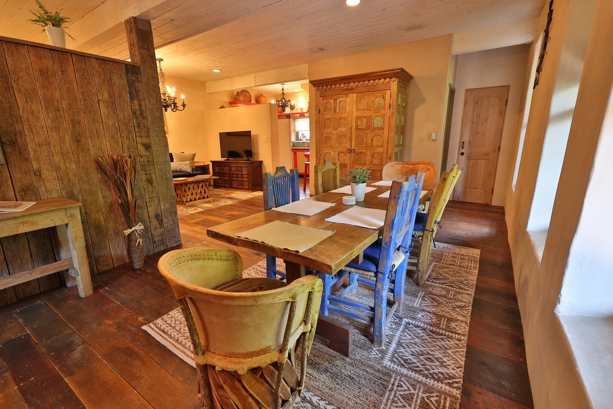 A large kitchen table in a spacious southwestern-styled room.