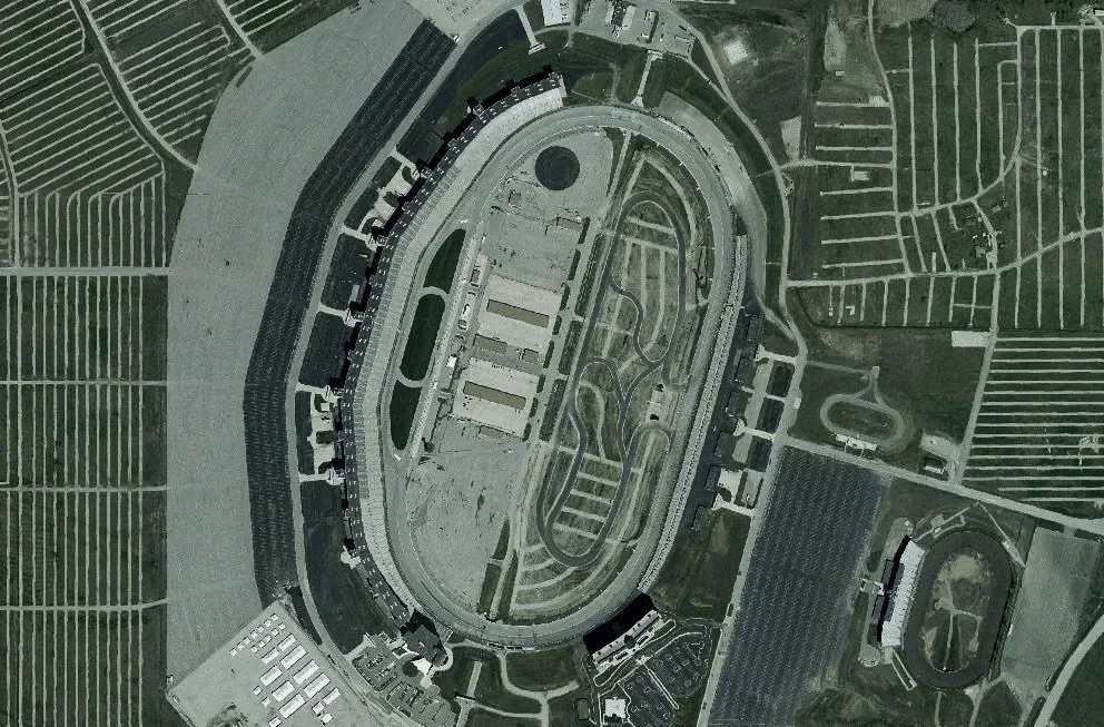 Satellite view of texas motor speedway a race track and surrounding areas, with surrounding fields and roads off IH-35W near Roanoke, TX