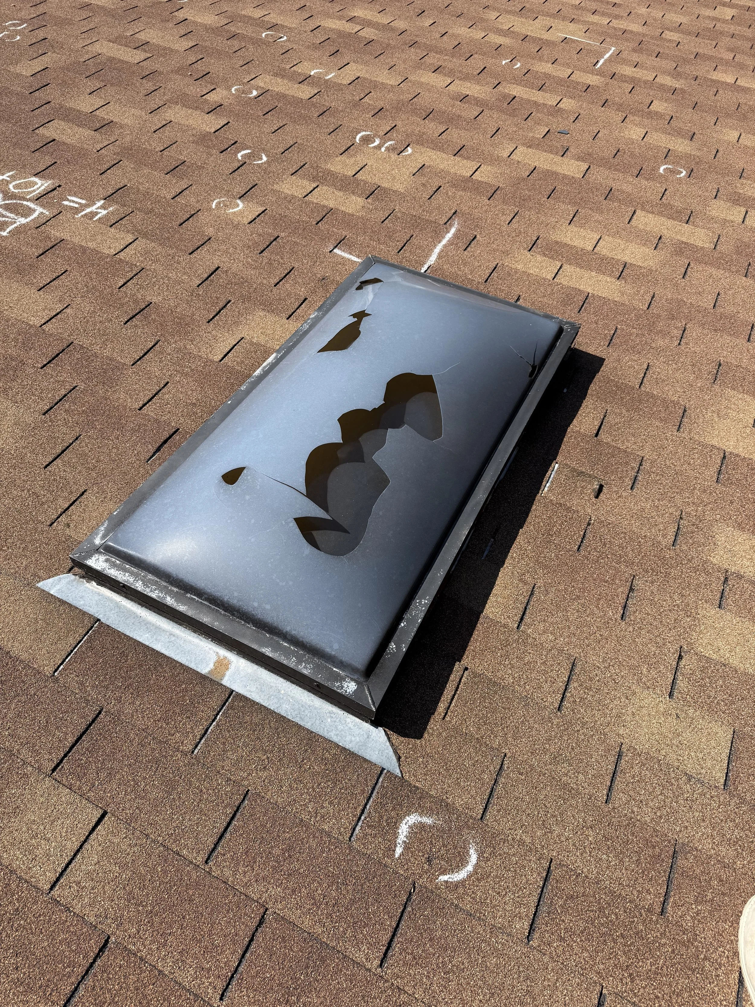 Broken roof vent on an asphalt shingle roof during a residential roof inspection