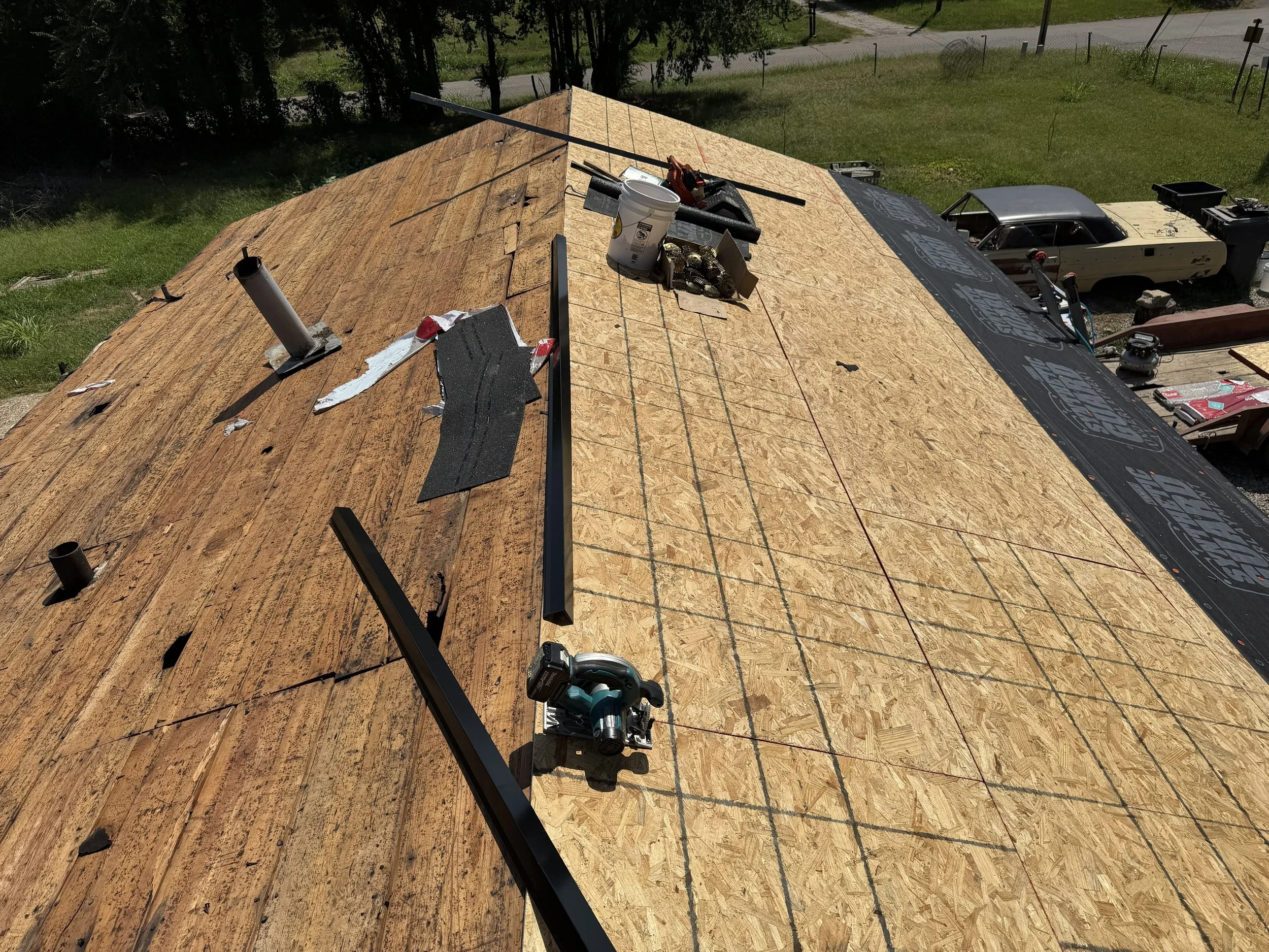 Plywood sheathingand building materials. A roof is being redecked.