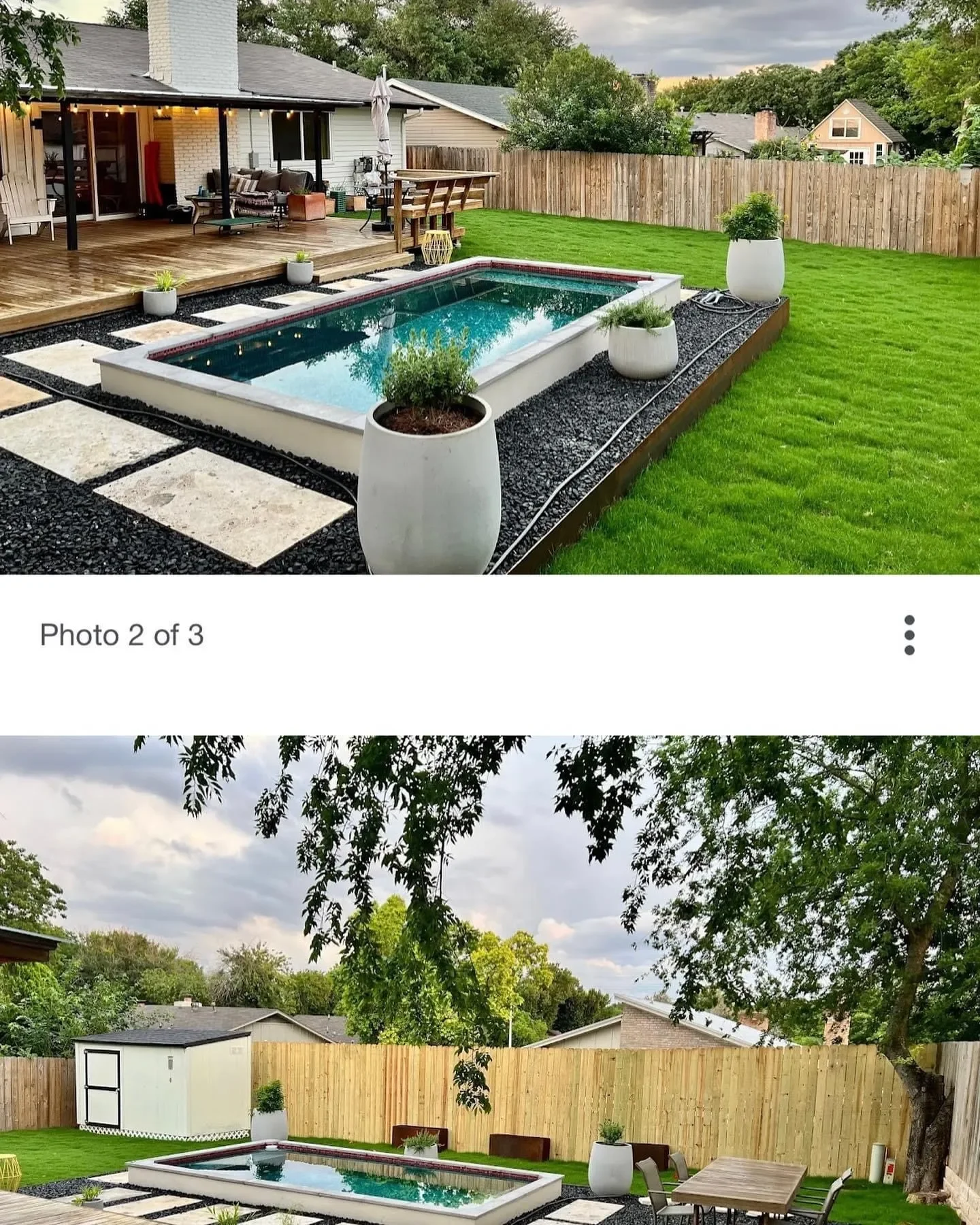 Backyard with a swimming pool, green grass, and a wooden fence. There is a covered patio with outdoor furniture and a small shed in the yard. Large potted plants decorate the area, and trees provide shade.