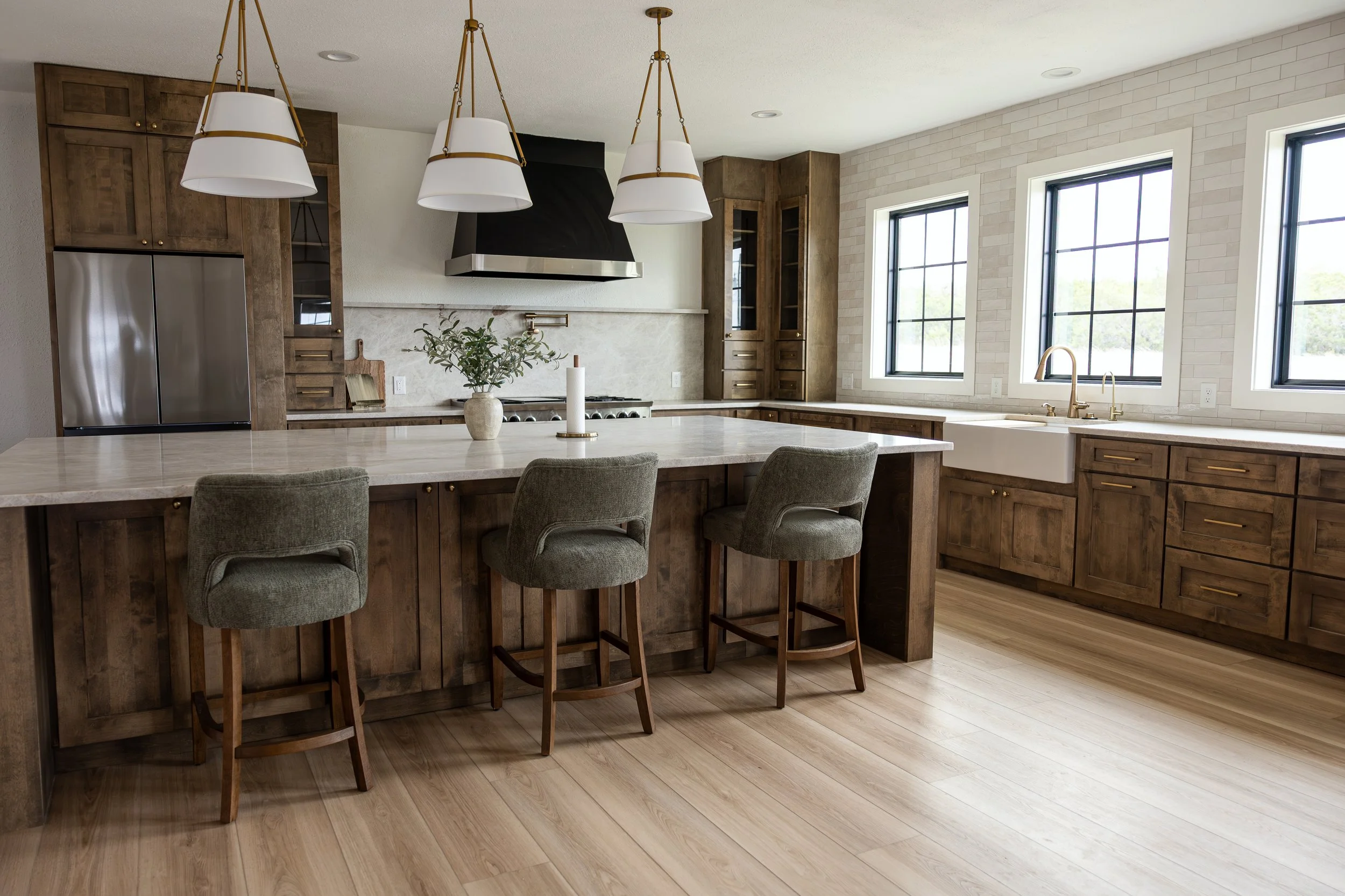 A stunning transformation showcasing custom cabinetry, premium countertops, designer lighting, and thoughtful space planning. This kitchen remodel combines timeless craftsmanship with modern functionality, creating a warm and inviting heart of the ho