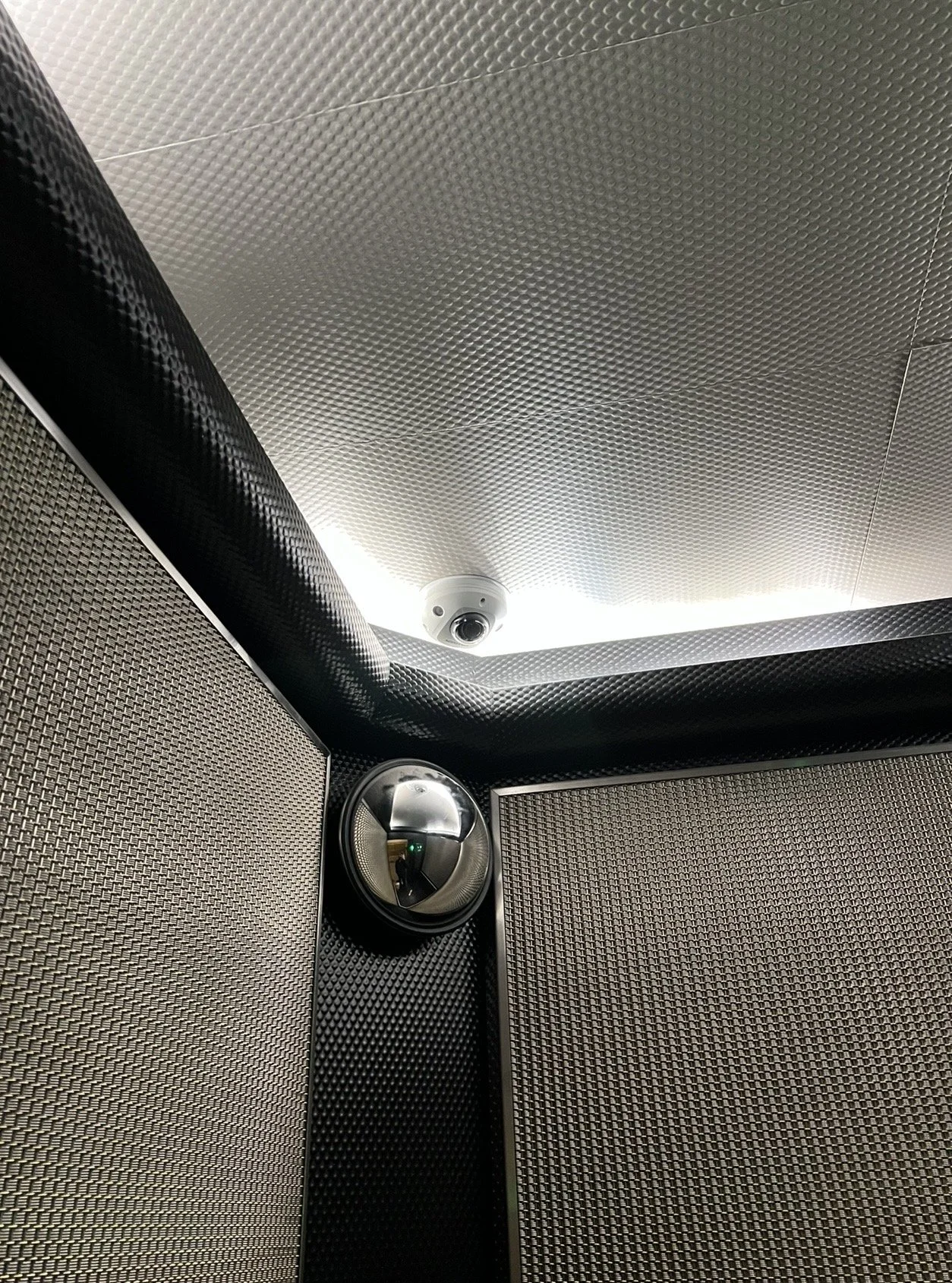 Security camera installed inside elevator cab for safety in residential building in NYC - Impera Security Systems. 