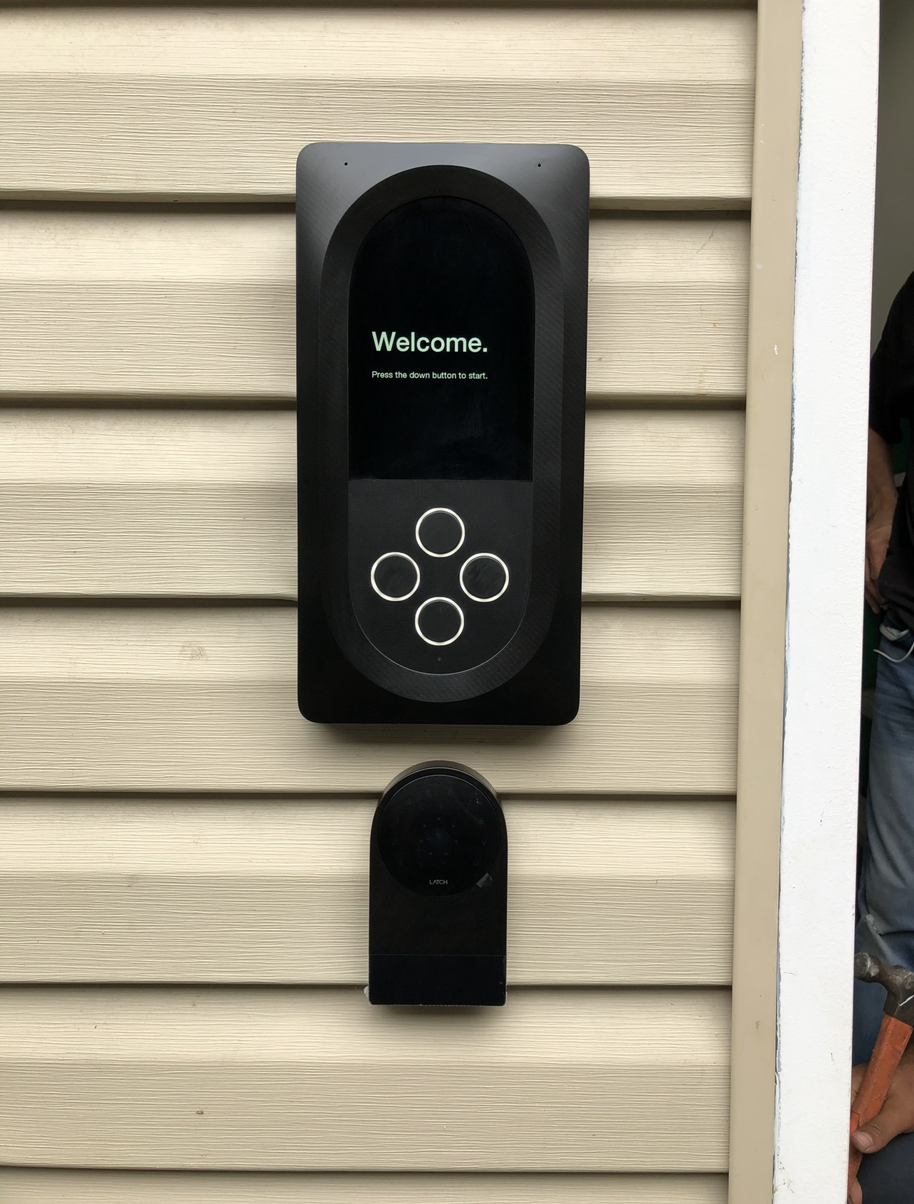 Residential smart video intercom system installation on a home exterior entrance wall.
