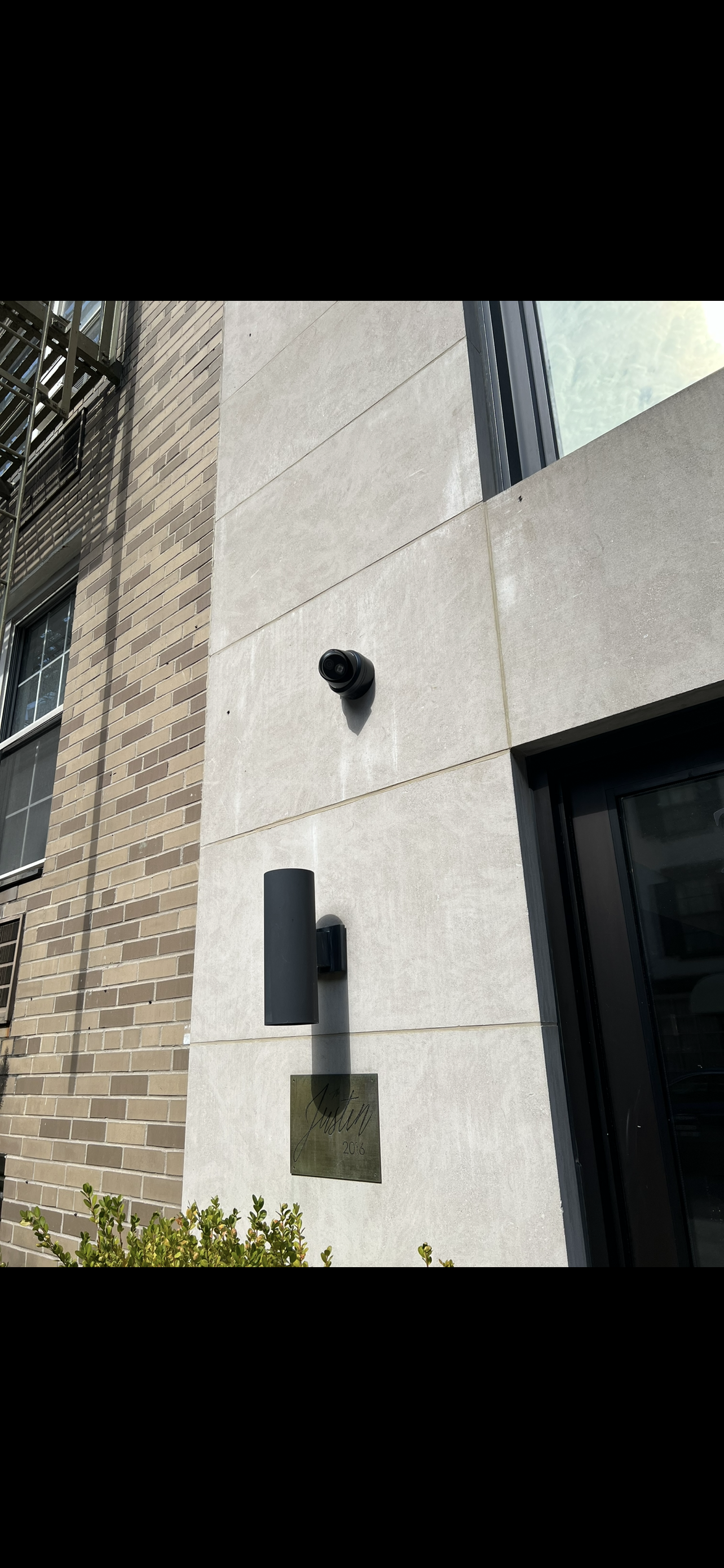 Outdoor security camera installed in a backyard for perimeter protection in NYC - Impera Security Systems. 