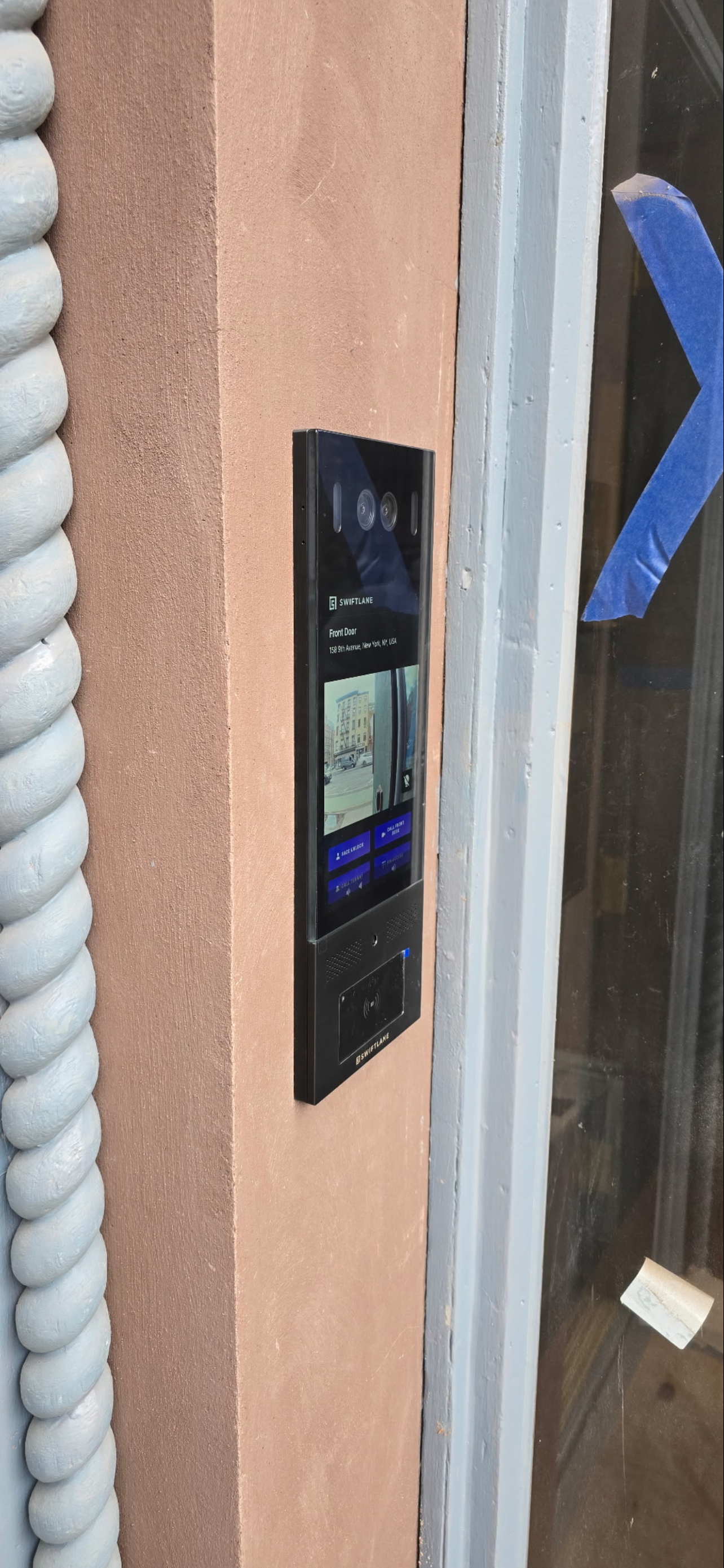 Swiftlane smart video intercom system installed at a building entrance.