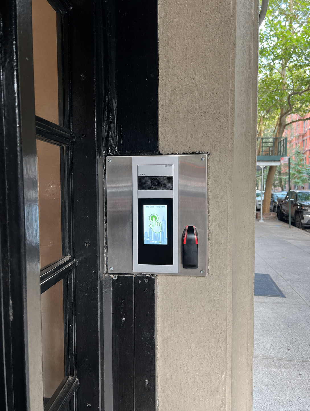 Comelit video intercom system installed at the entrance of a Manhattan apartment building.