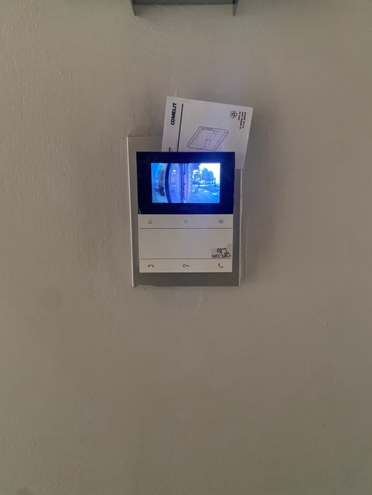Comelit indoor intercom monitor installation for resident communication and access.