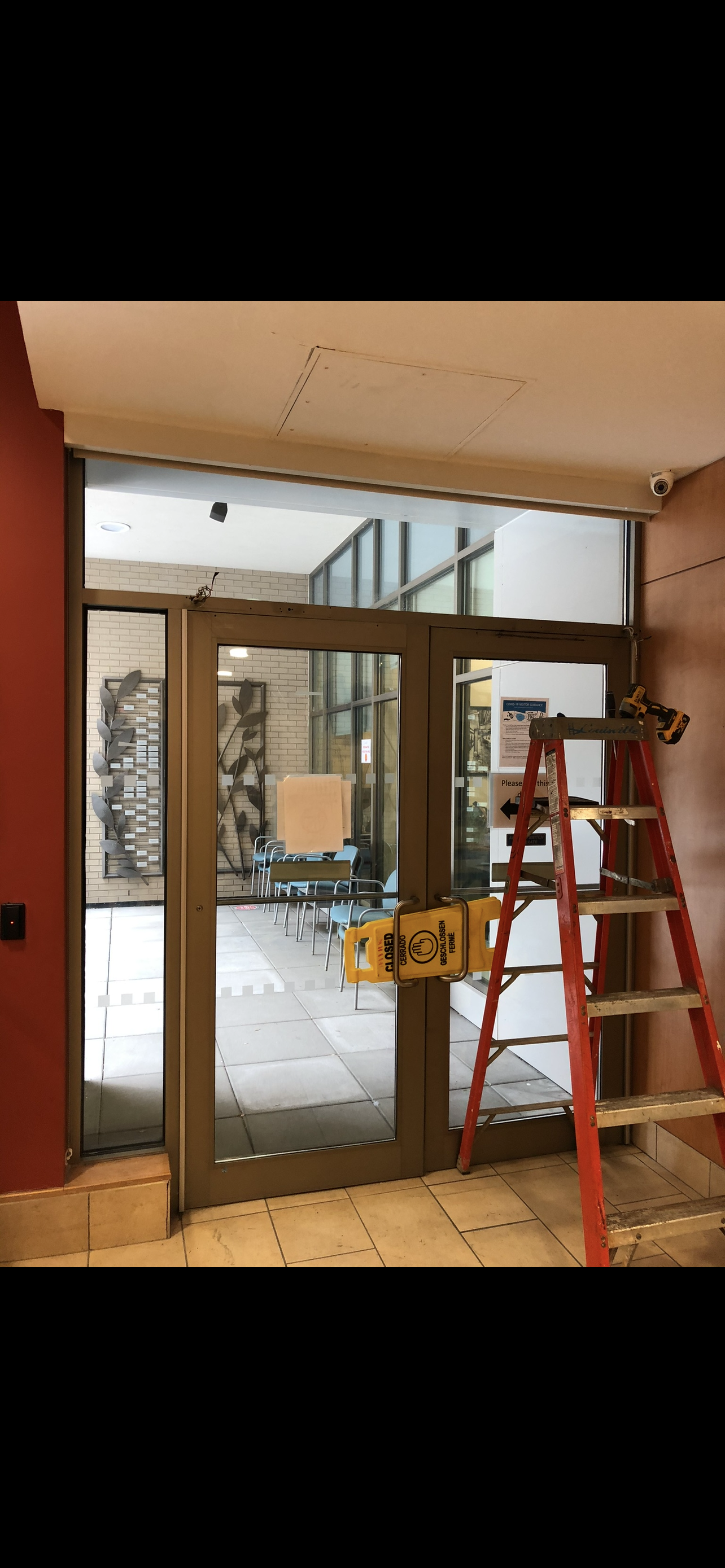 DITEC automatic door operator installed for secure, hands-free building access for residents and visitors.