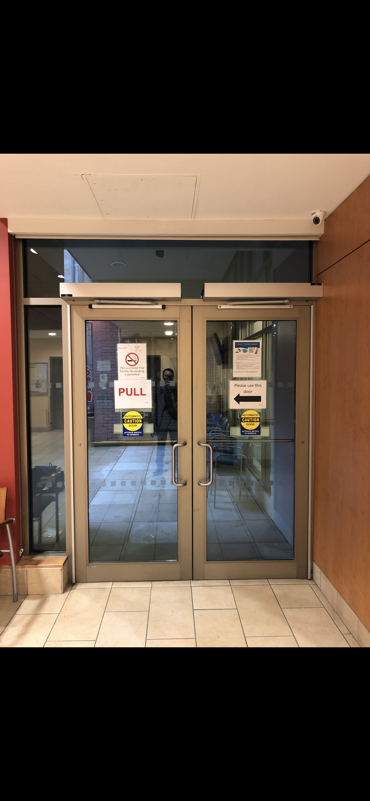 DITEC automatic door operator installed for secure, hands-free building access for residents and visitors.