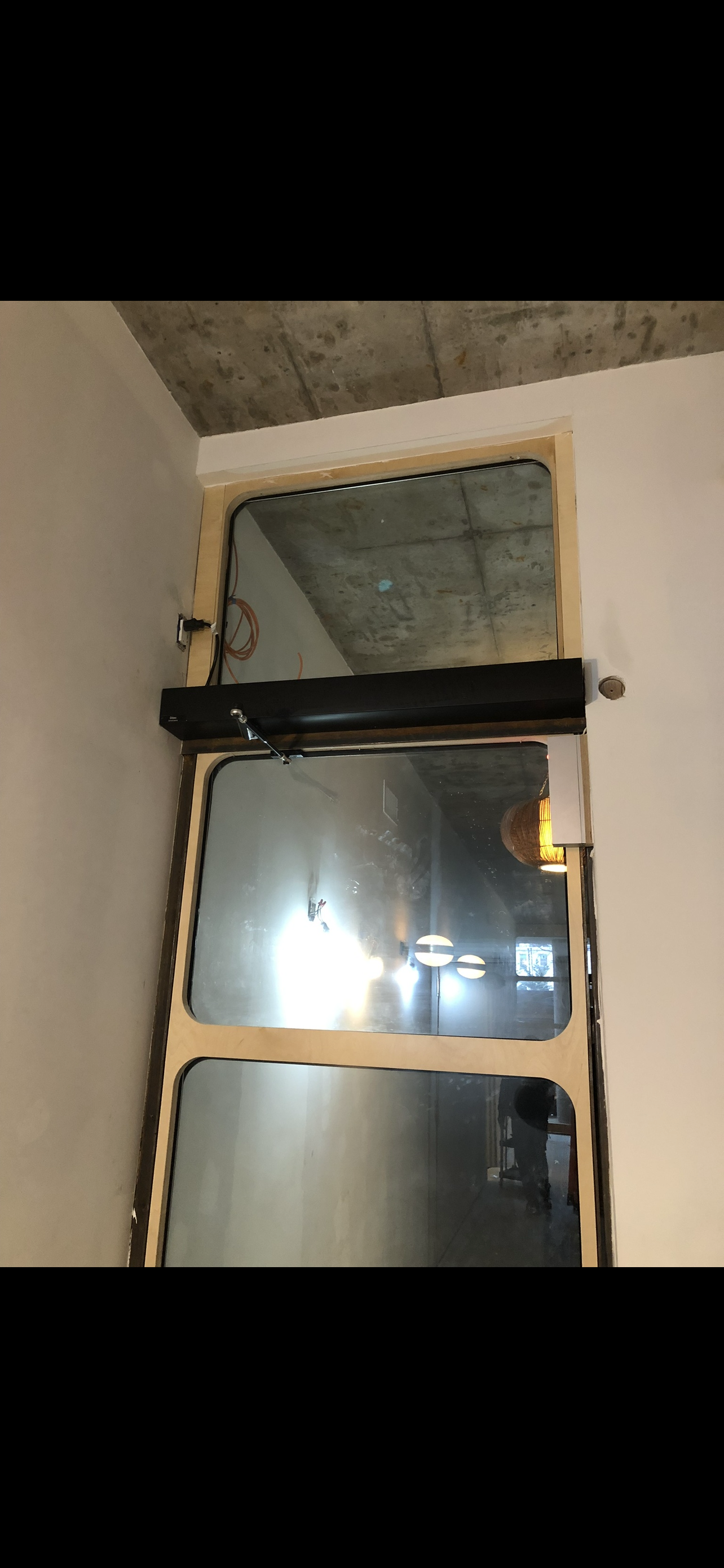 DITEC automatic door operator installed for secure, hands-free building access for residents and visitors.