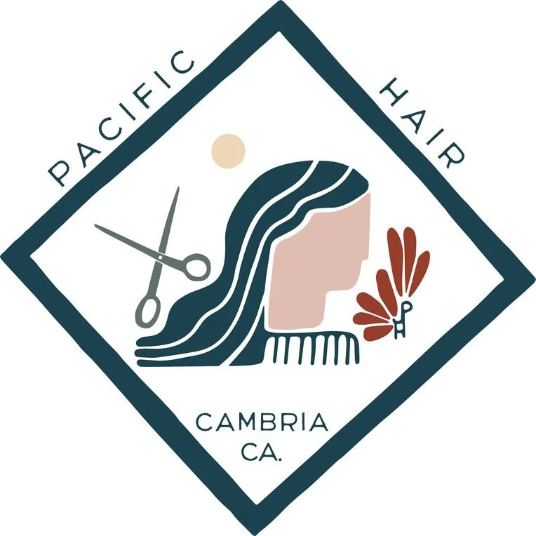 Logo for Pacific Hair in Cambria, California, featuring a woman's profile with styled hair, a pair of scissors, a butterfly with a key, and a sun in a diamond-shaped border.