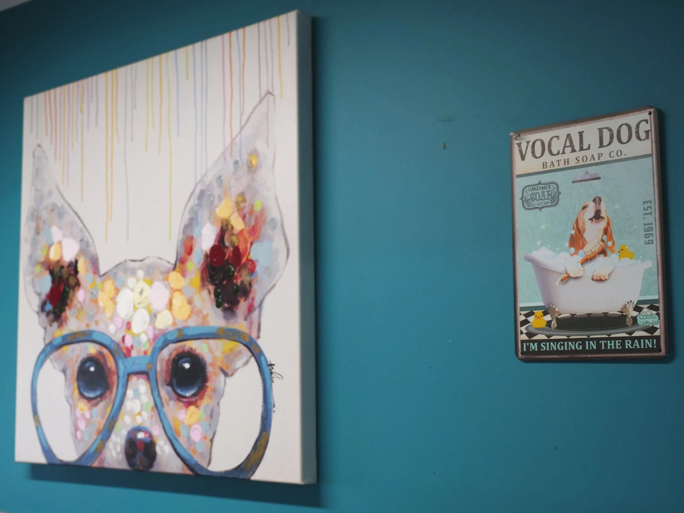 Dog themed art hanging inside a HALO K9 overnight kennel