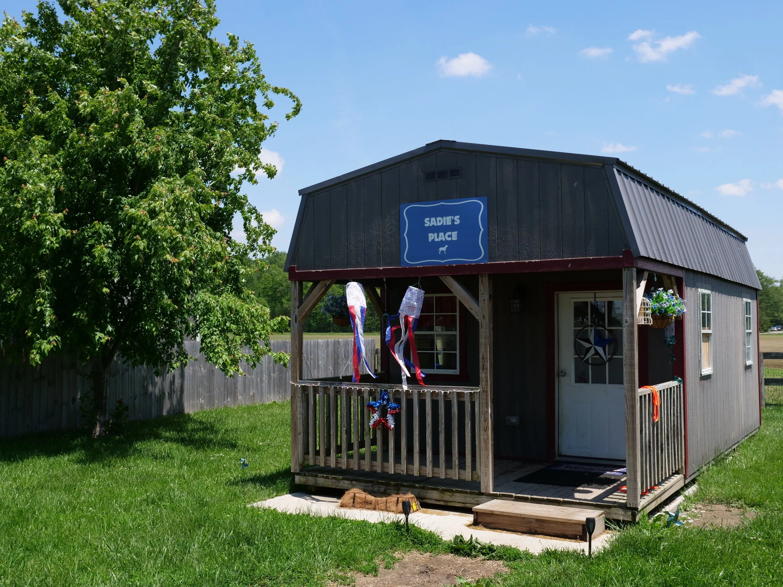 Sadie's Place, a tiny home for private accommodations at HALO K9. Equipped with a queen size bed and furniture for a cozy stay.