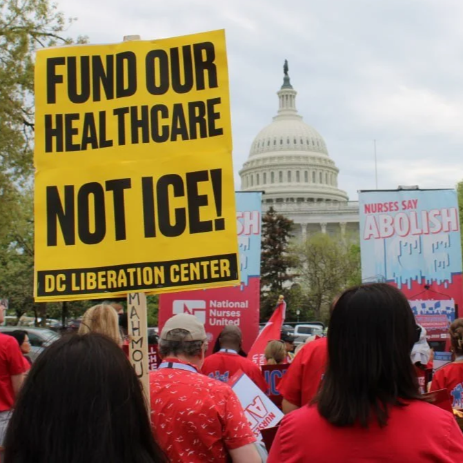 Protesters gather in front of the Capitol building holding signs urging healthcare funding and nurses' rights, including a yellow sign reading 'Fund our healthcare, Not Ice!'