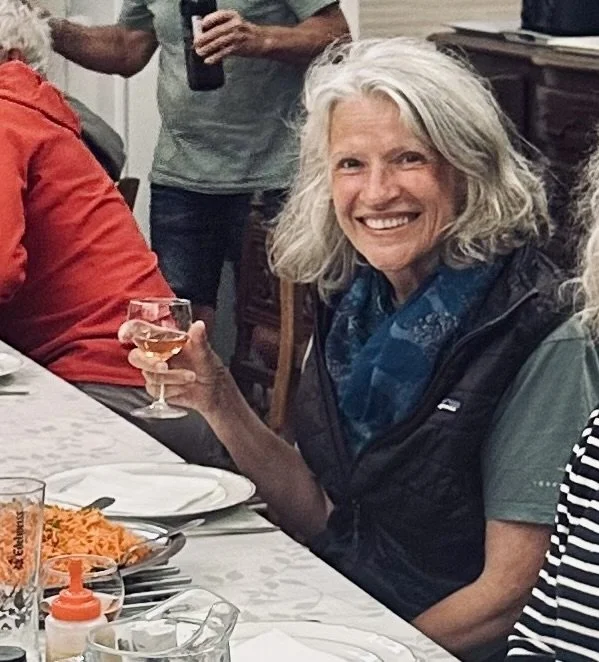 Woman holding a glass of wine and smiling