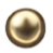 Blurred circular object with a dark center and glowing edges, possibly a metallic or reflective surface.