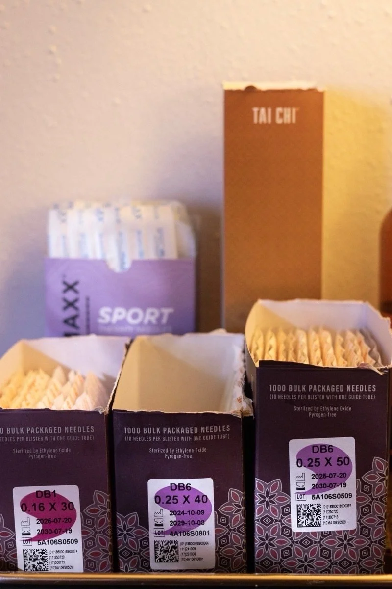 Tray of acupuncture needles, oils and supplies at the clinic.