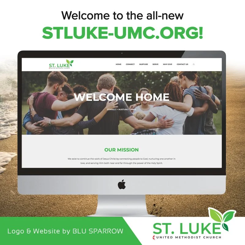 A promotional image of a church website called ST. LUKE, displayed on an iMac computer on a sandy surface, with a group of diverse people hugging. The text says "Welcome to the all-new STLUKE-UMC.ORG!" and the website features sections like Home, Con
