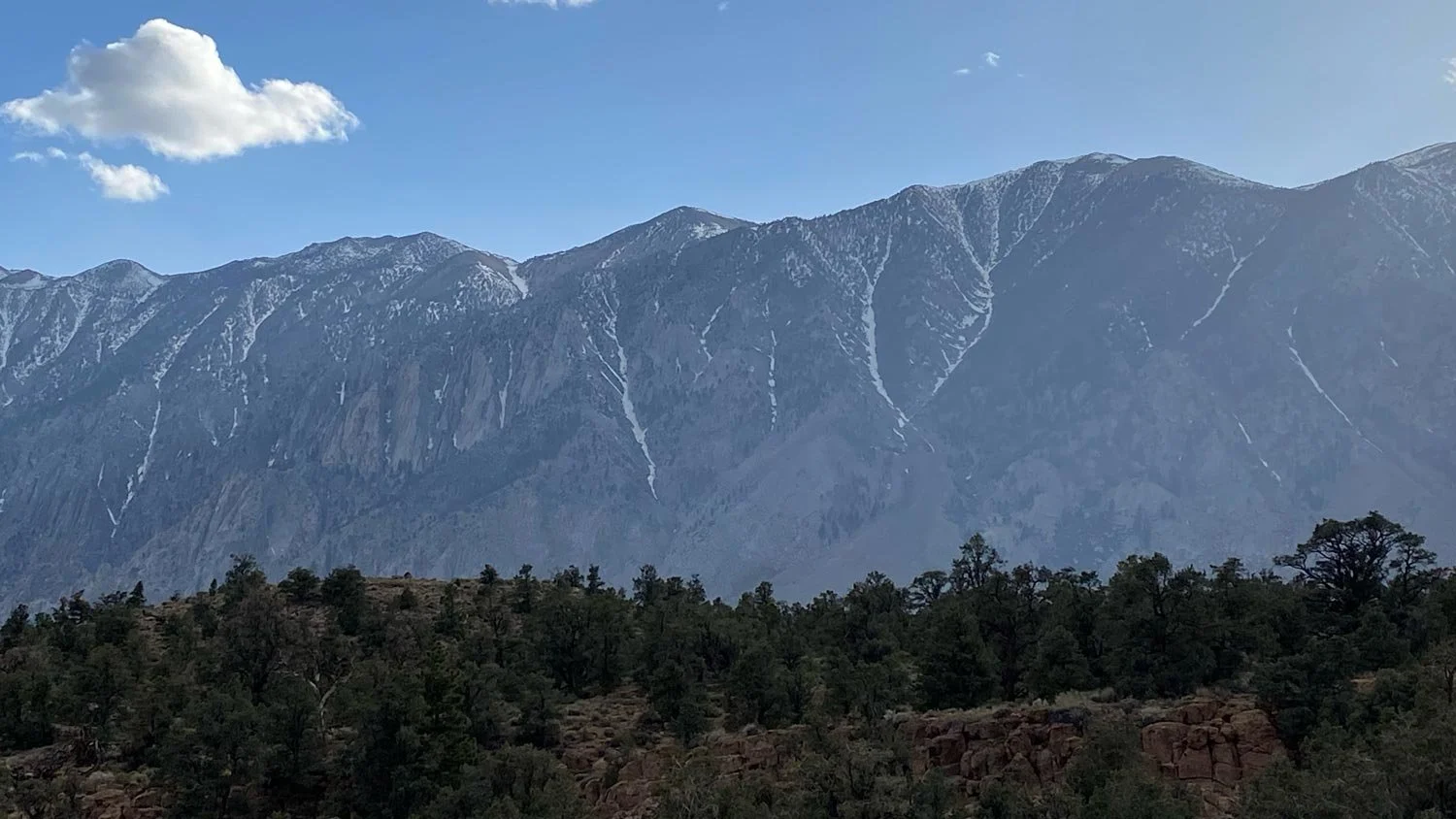 Mountains rise over Riverside County and a blue sky.