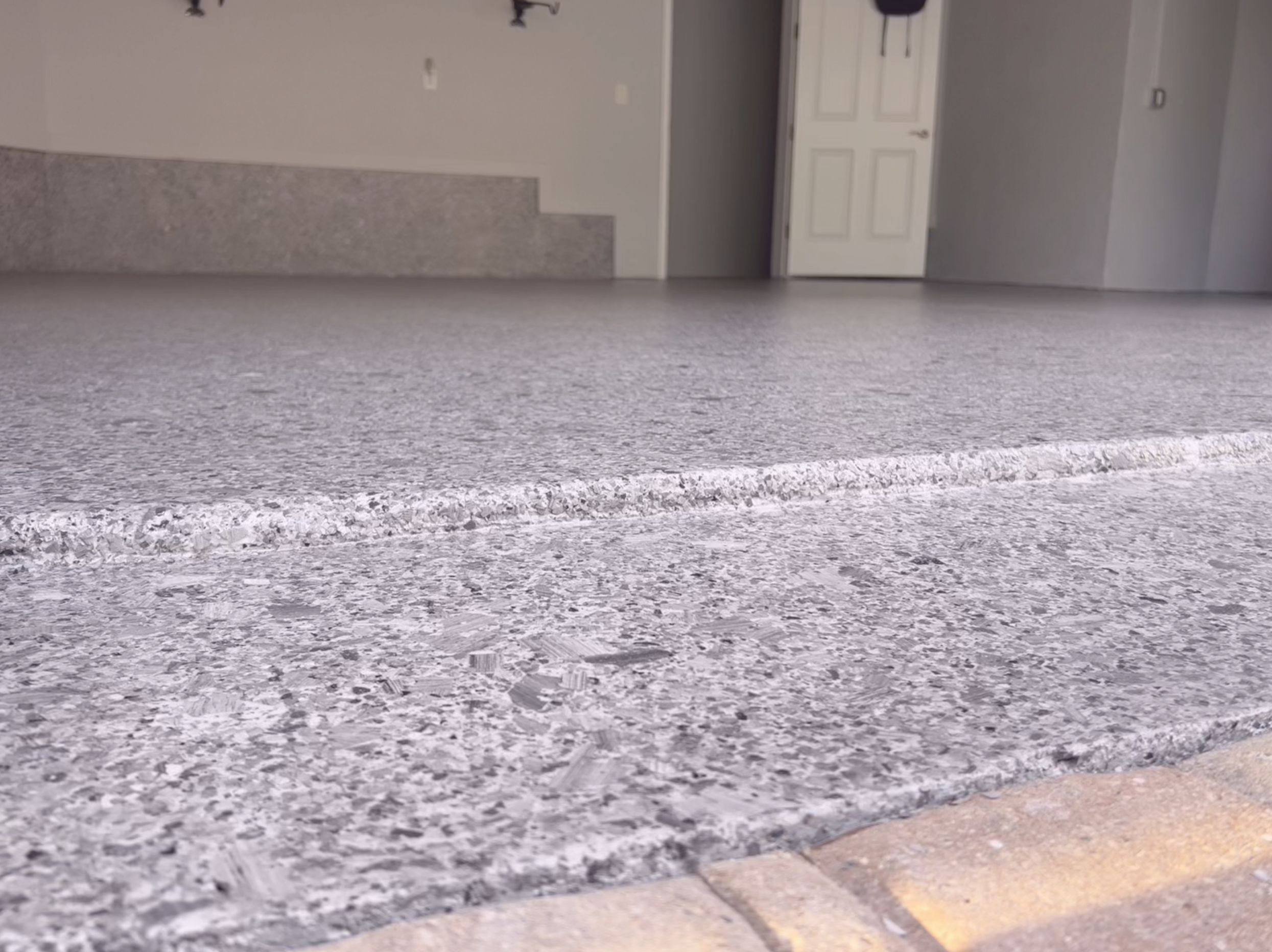 Close-up of epoxy full chip system installed in home garage.