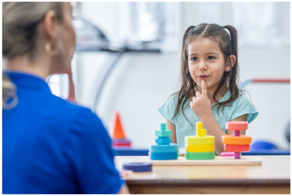 Child practicing speech sounds with a pediatric speech-language pathologist
