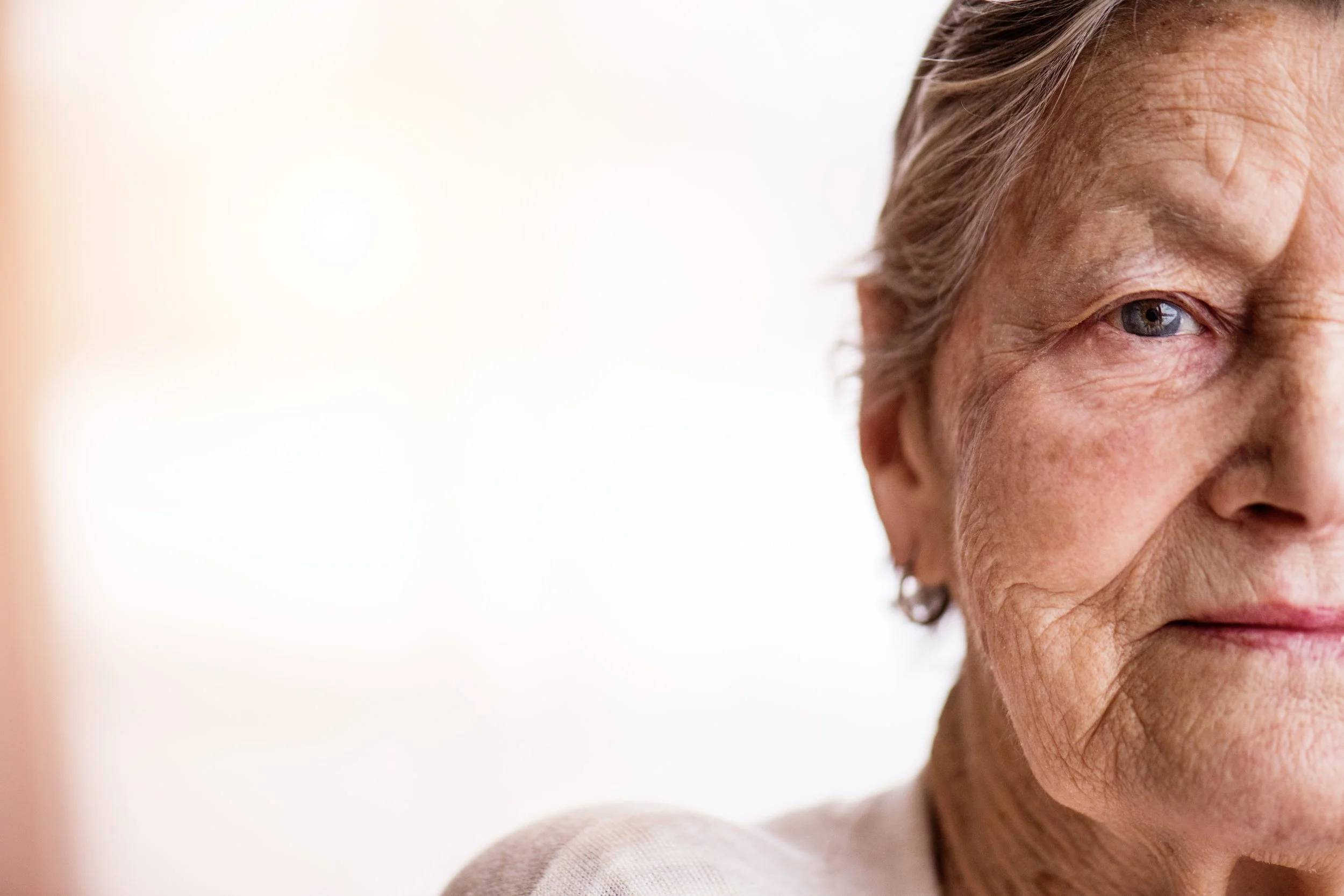 Close up of older woman looking straight at camera