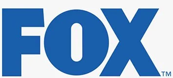The logo of FOX, a media company, in blue capital letters.