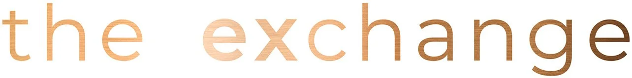 Text reading 'the exchange' in large lowercase letters with a neutral background.