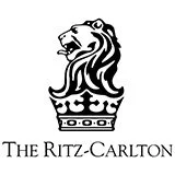 Ritz-Carlton logo with a stylized lion's head above a crown, accompanied by the text 'The Ritz-Carlton'.