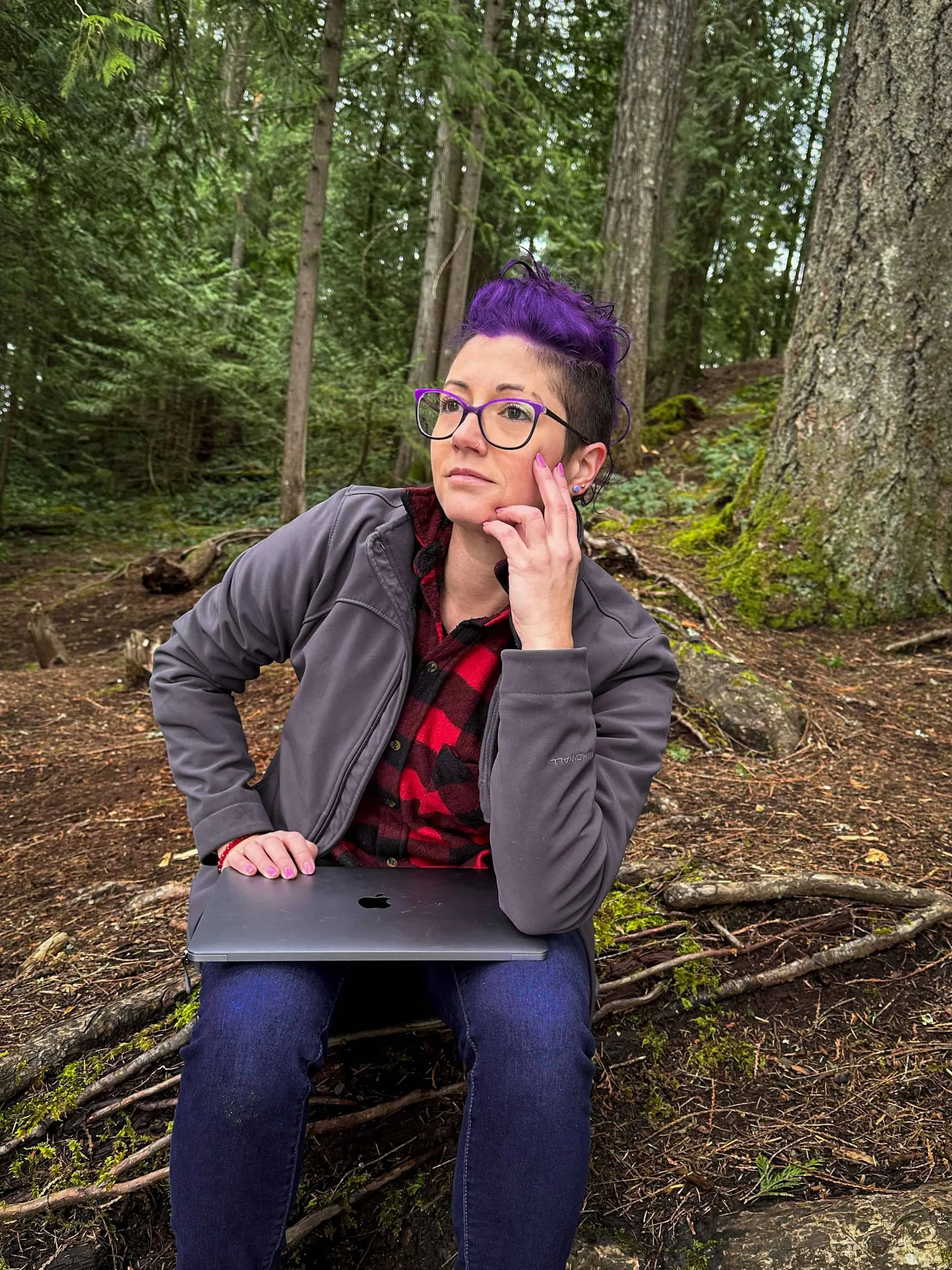 Outdoor creator planning trail content while working in the forest on Vancouver Island.