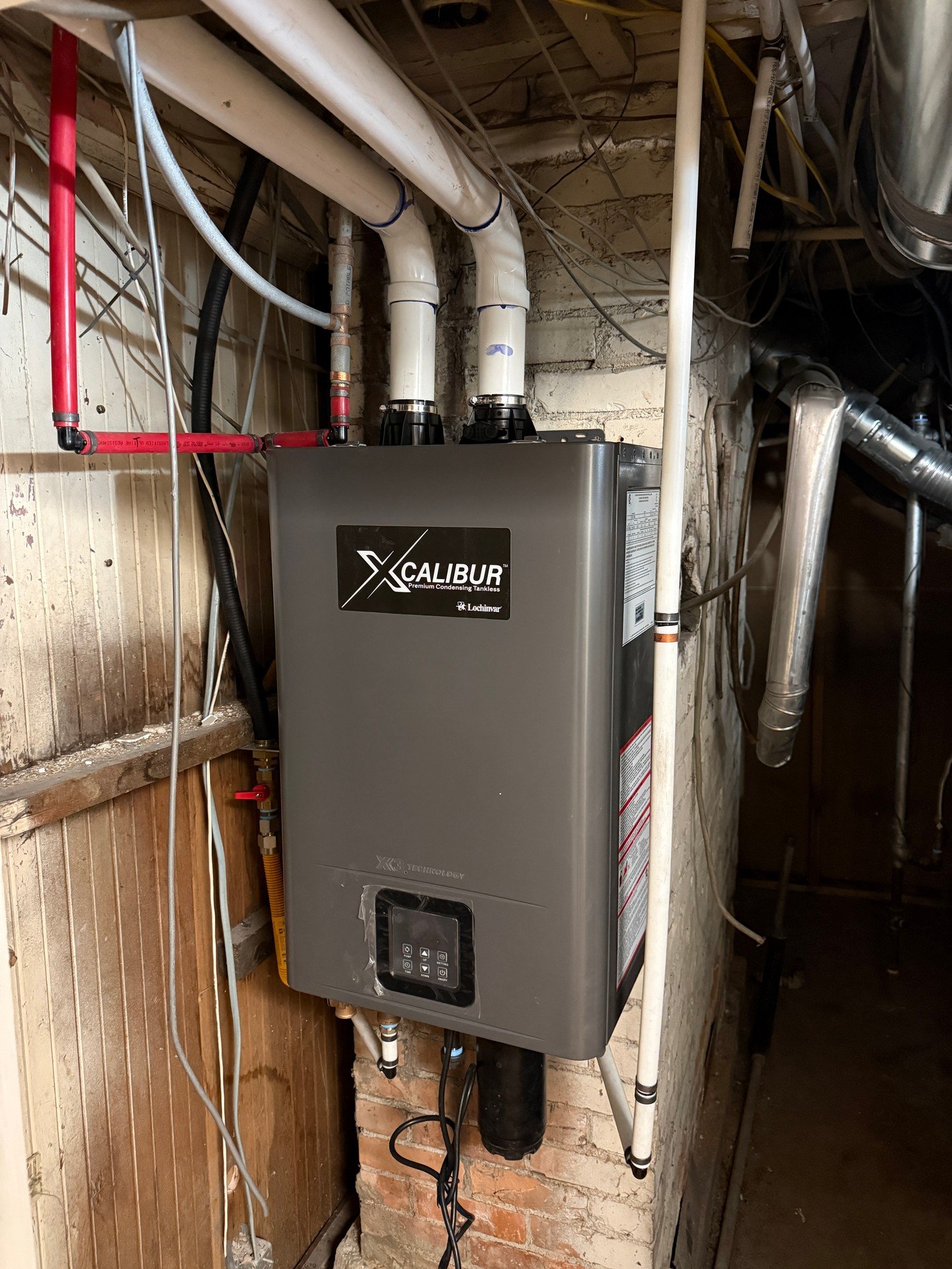 Details matter on a tankless setup like this. We mounted it clean on the wall and tied in the water supply, drain, and vent with supported, accessible runs. All connections are pressure-tested and looking right.

Please call/text 801-808-1236 to make