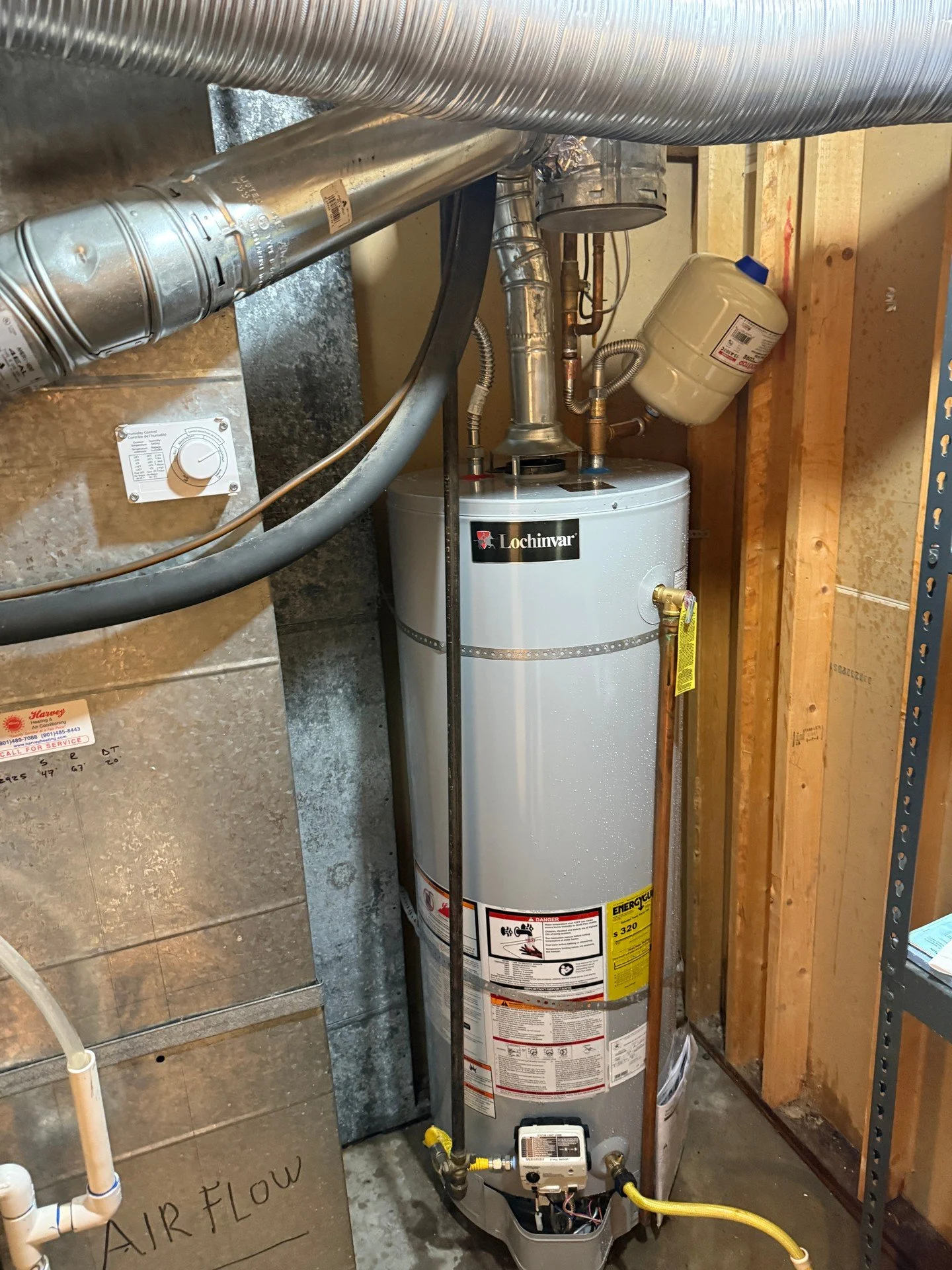 Wrapped up a clean water heater install today. Hot and cold lines tied in up top with flex connectors, expansion tank set on the hot side for pressure swings, and a properly secured metal vent sending flue gases out where they belong. Yellow gas flex