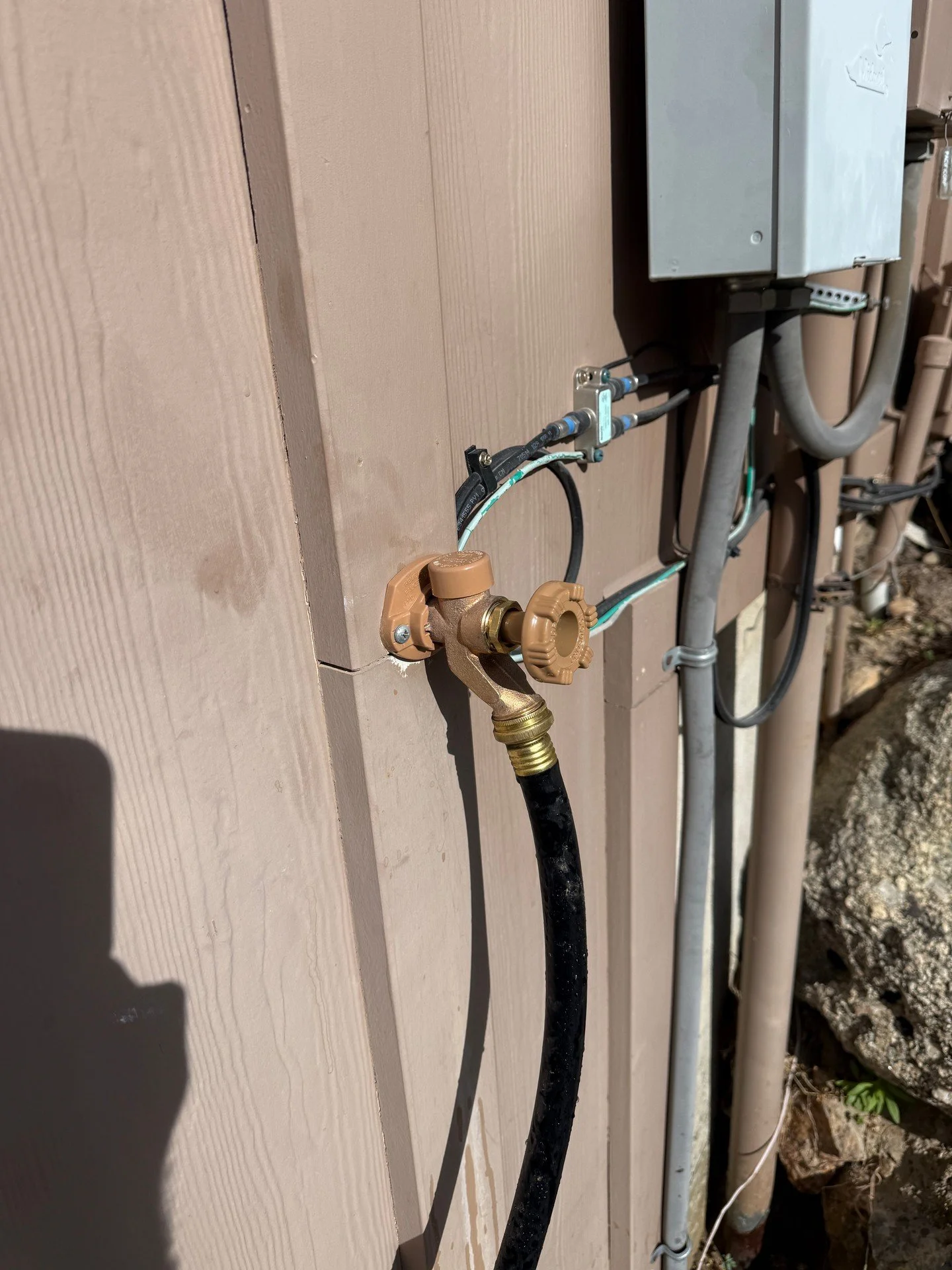 Small details keep outdoor water simple. This hose bibb is fastened cleanly to the siding and the wall penetration is sealed to keep moisture out. Straightforward setup with a standard garden hose, installed to stay put.

Please call/text 801-808-123