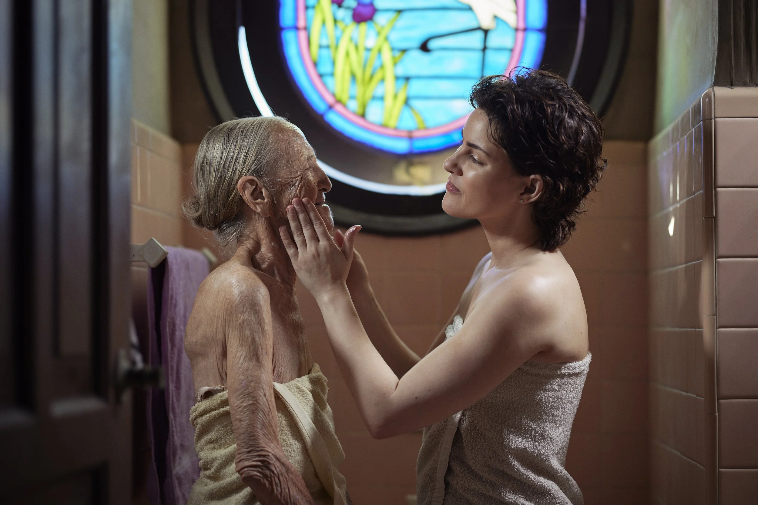 I help my grandmother Ester after her shower, with cream for her delicate skin