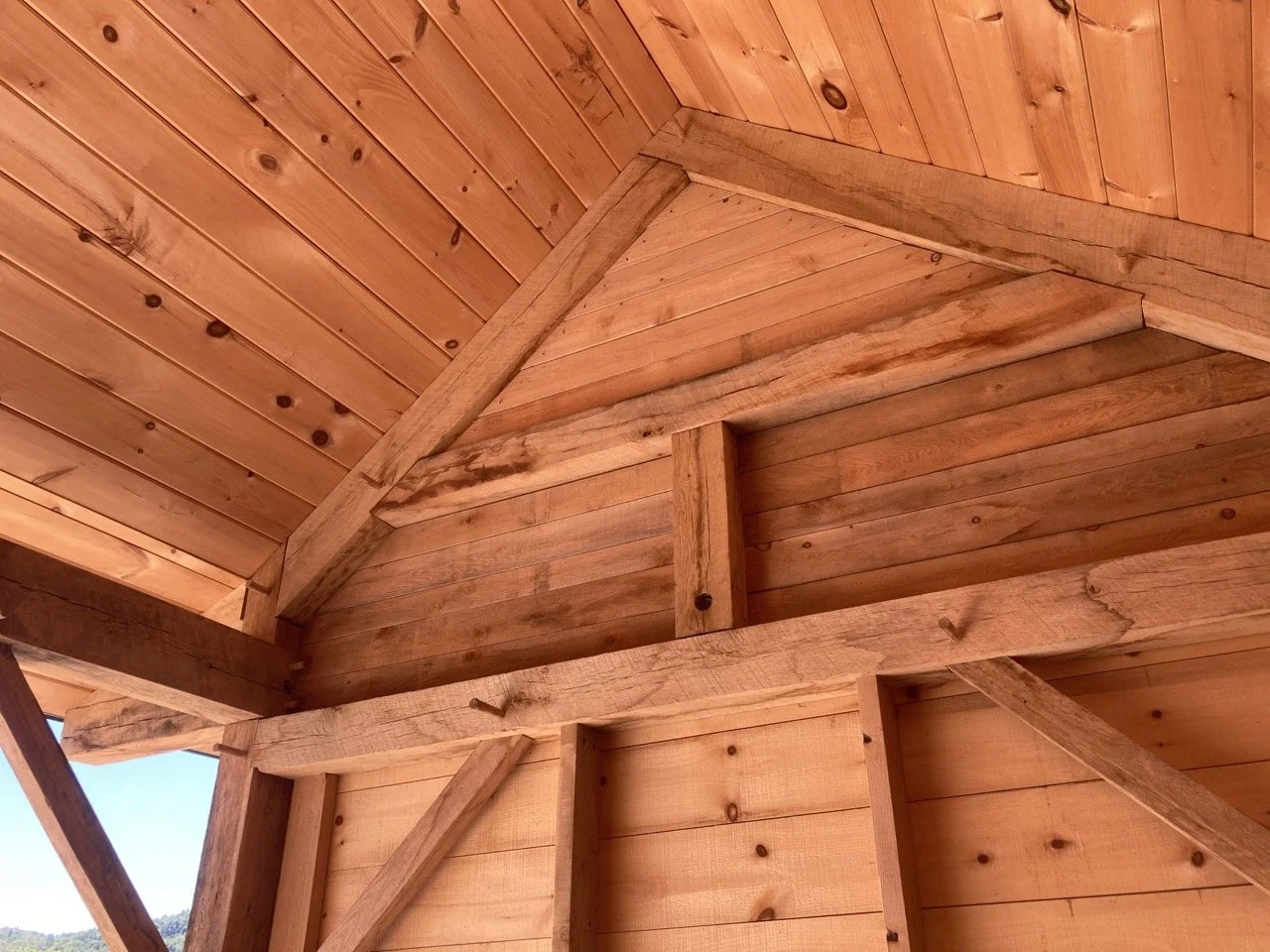 Close-up of wooden roof and wall framing using mortise and tenon joinery 