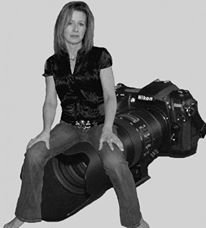 Self-portrait of Angelina Nikon, a 4th-generation antique restorer and professional photographer, reflecting her 25-year creative journey from the lens to the workshop.