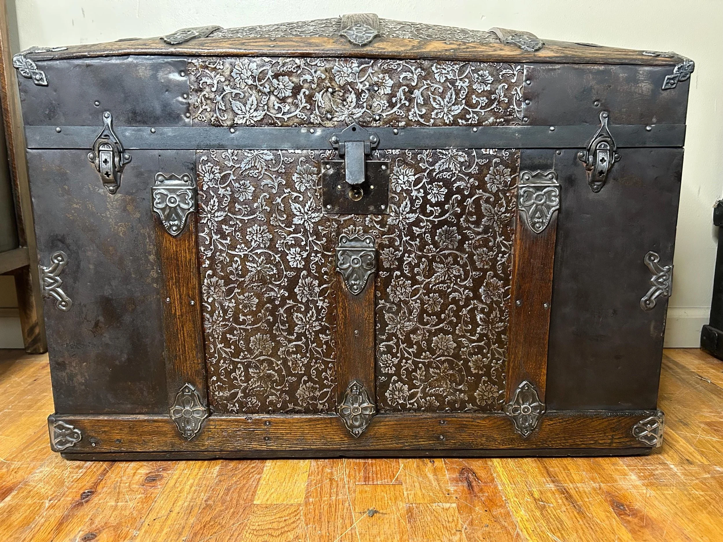 Victorian style dome top trunk repurposed as a luxury statement piece.