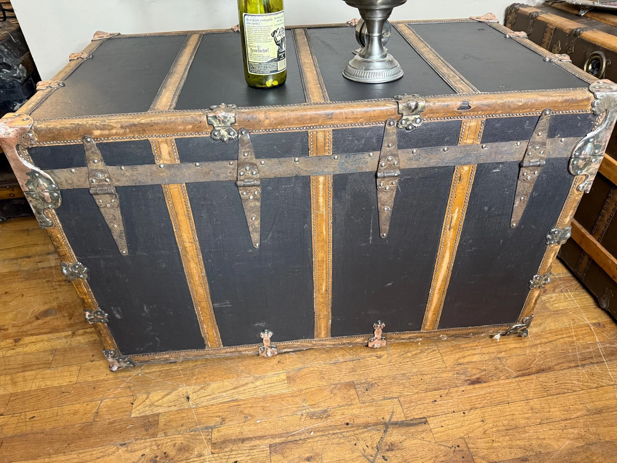 Massive heritage blanket box providing functional storage and a level table surface.