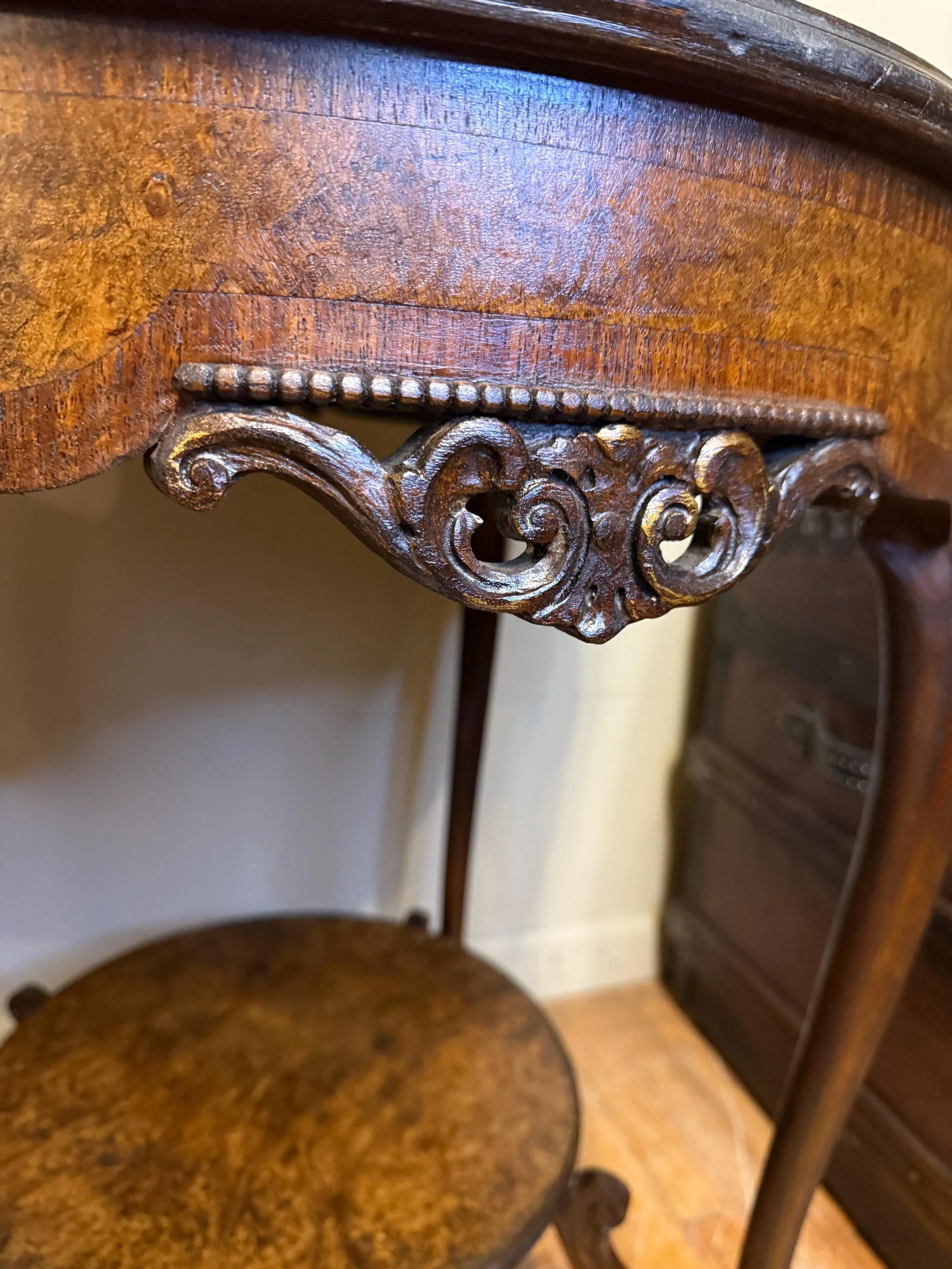 Architectural 1800s lamp table ready to serve as a focal point in a home library.