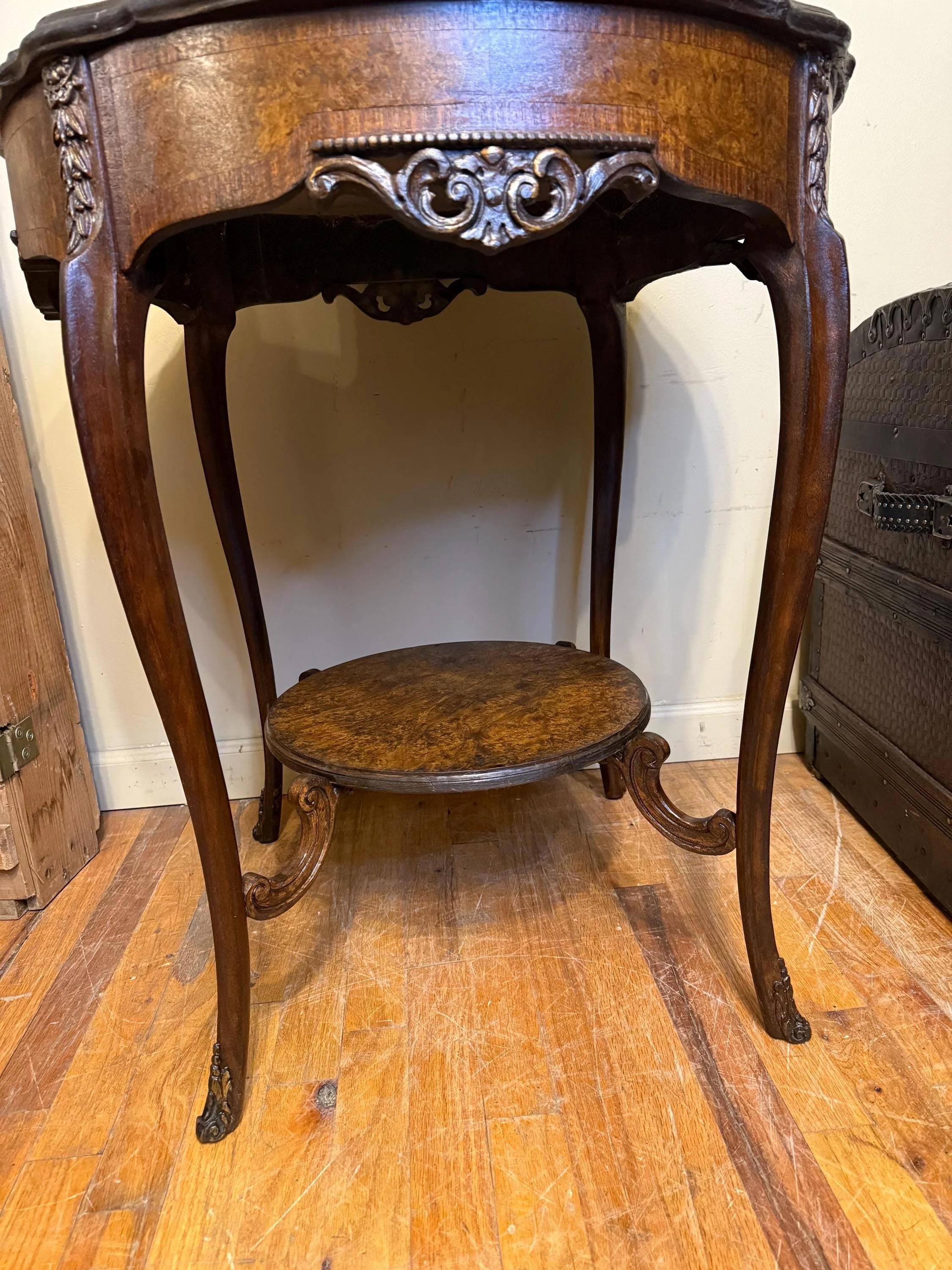 Professionally finished antique furniture piece highlighting the depth of the burl grain.