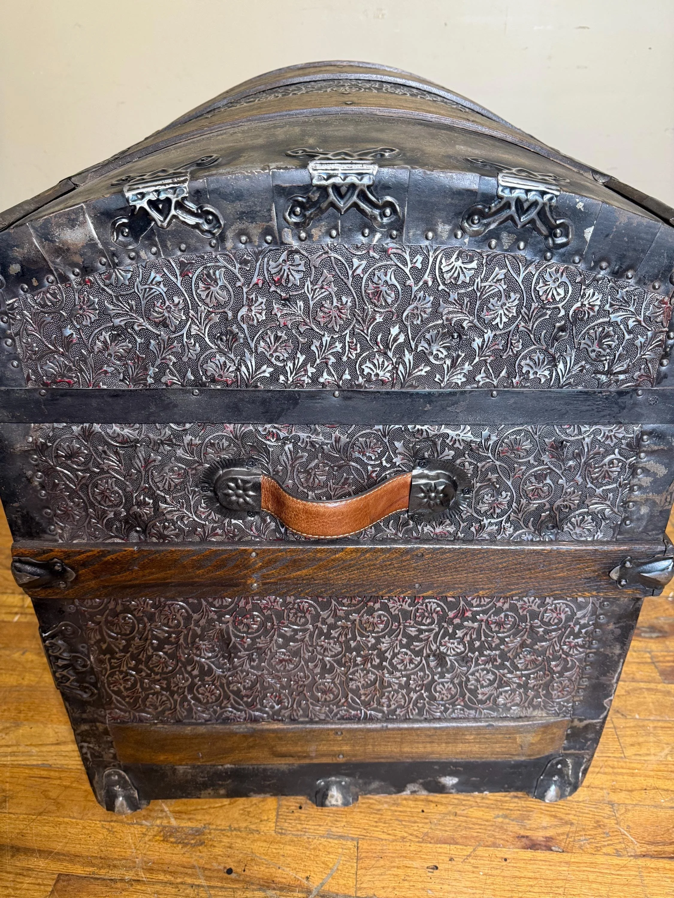 Side profile highlighting the extra-tall arched lid of a 19th-century Victorian humpback chest.