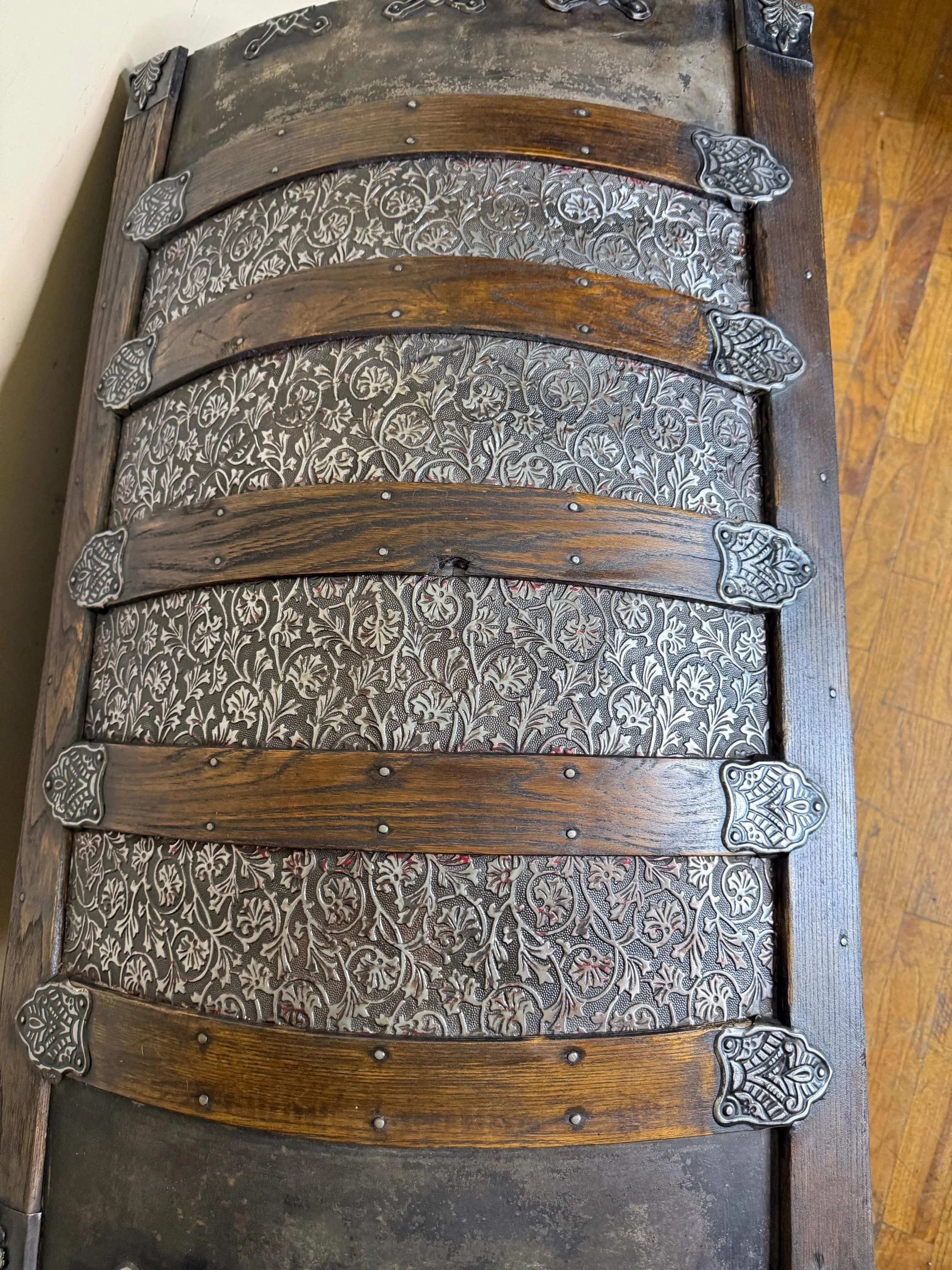 Top-down view of the high arched dome lid with hand-buffed rivets and hardware.